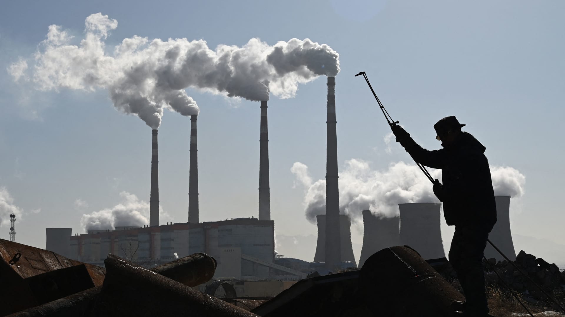 A worker cutting steel pipes near a coal-powered power station in Zhangjiakou, China, on Nov. 12, 2021. The country's biggest consumers of steel and its economic growth engines — such as property construction and infrastructure development — have gone quiet, according to one analyst.