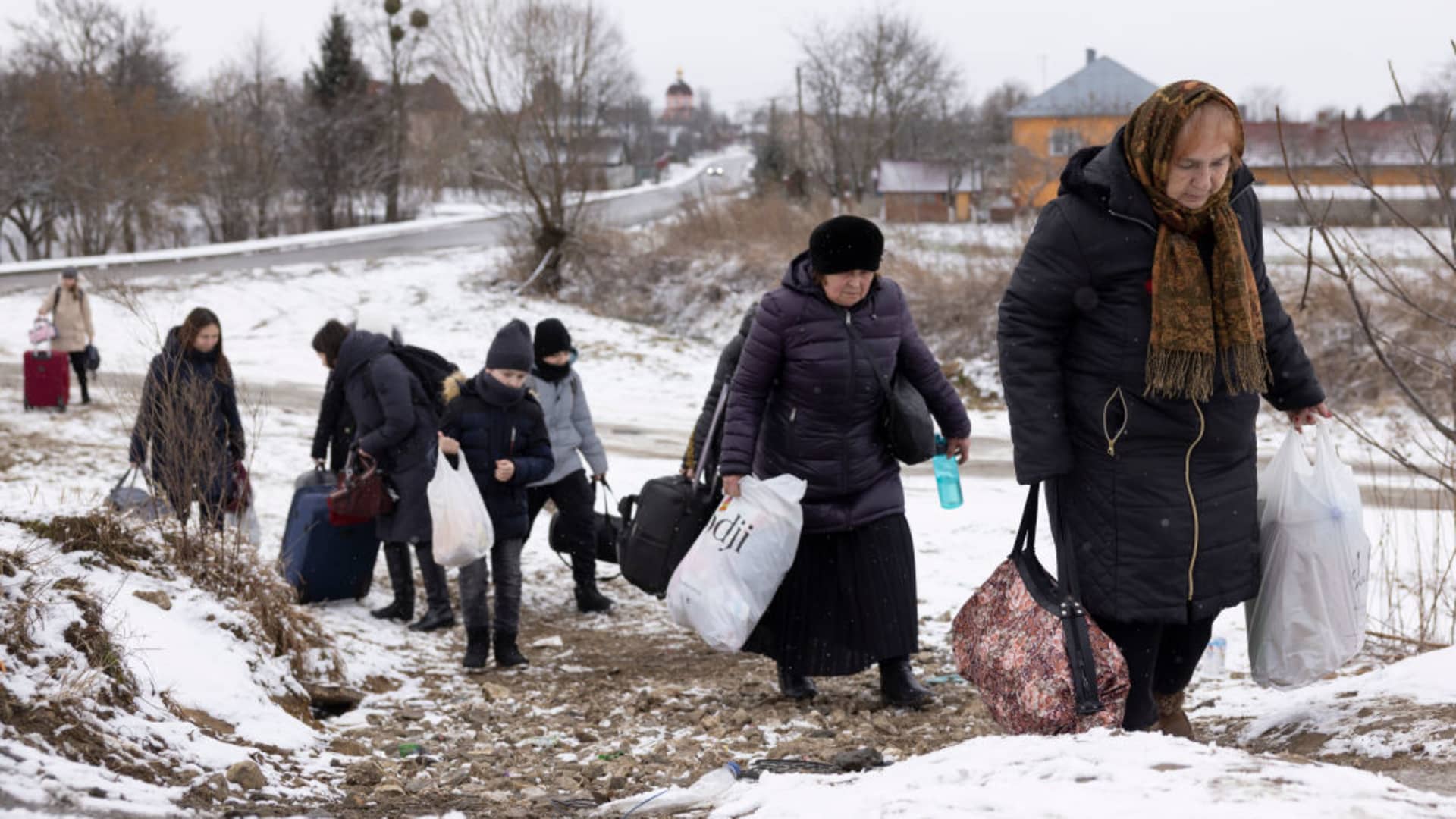 Refugees fleeing conflict make their way to the Krakovets border crossing with Poland on March 09, 2022 in Krakovets, Ukraine.