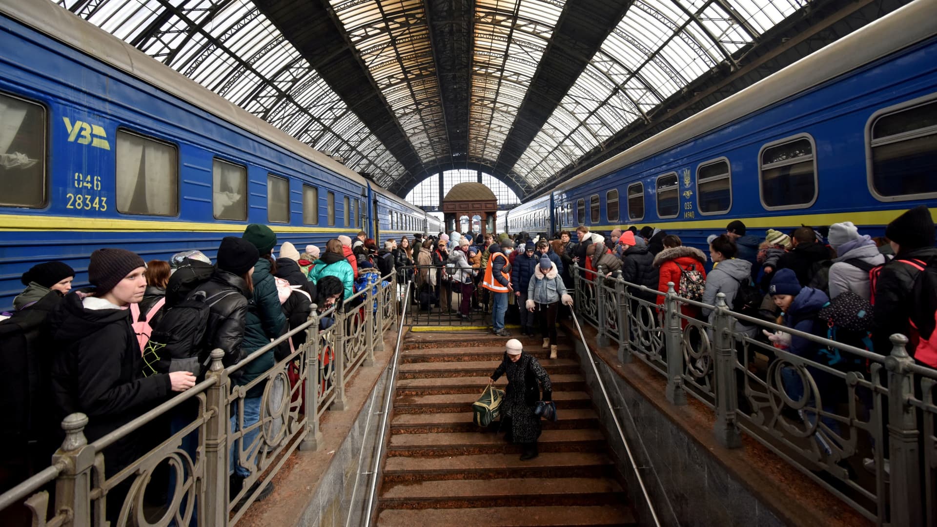 People fleeing Russia's invasion of Ukraine gather at the train station in Lviv, Ukraine, March 9, 2022.