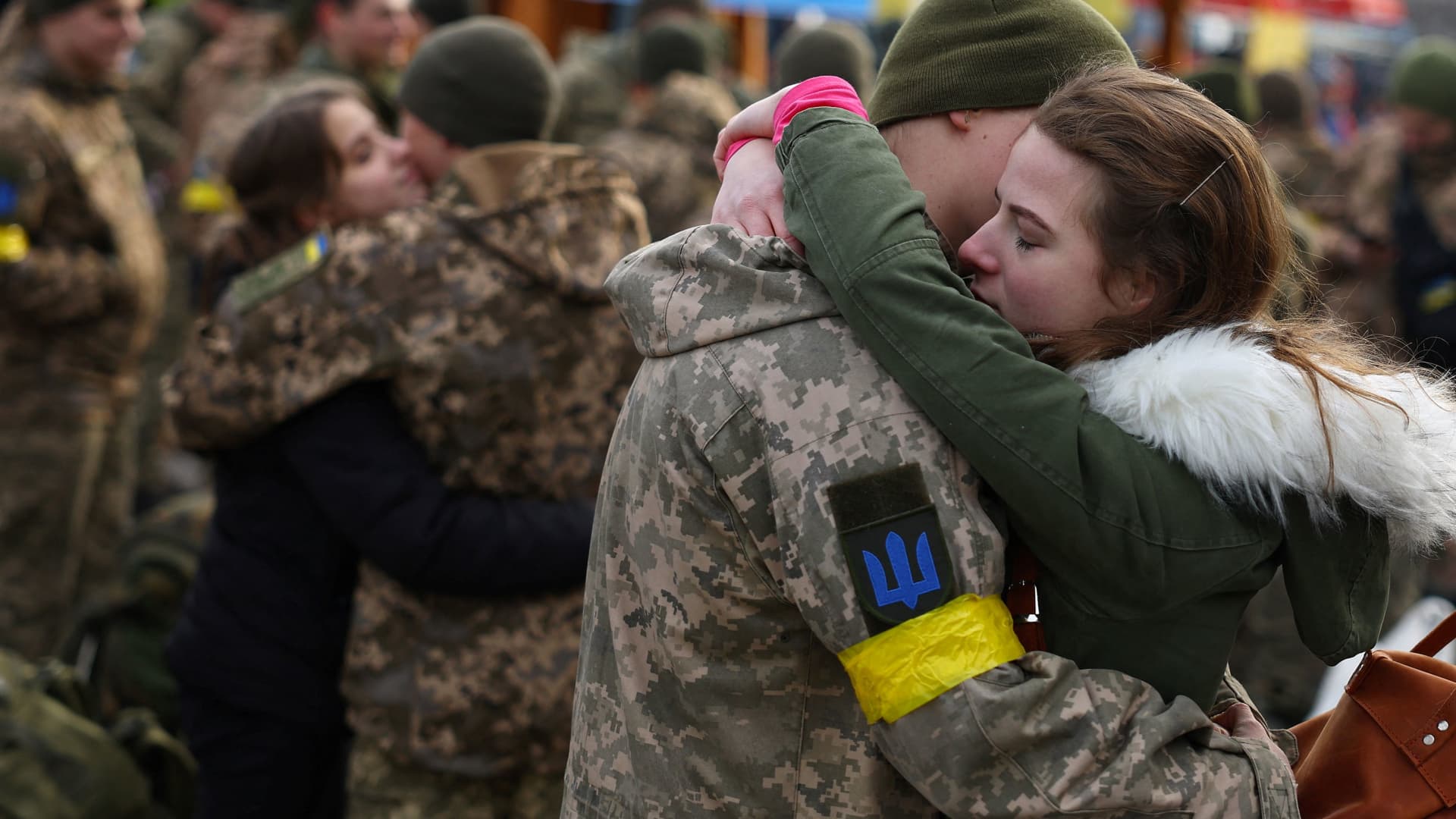 Olga hugs her boyfriend Vlodomyr as they say good bye prior to Vlodomyr's deployment closer to the front line, amid Russia's invasion of Ukraine, at the train station in Lviv, Ukraine, March 9, 2022.