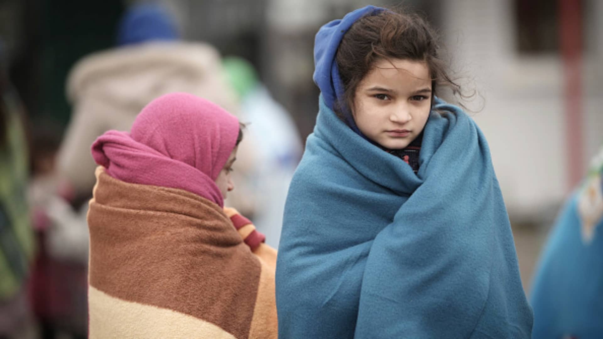 Refugee children fleeing Ukraine were given blankets by Slovakian rescue workers to keep warm at the Velke Slemence border crossing on March 9, 2022, in Slovakia.