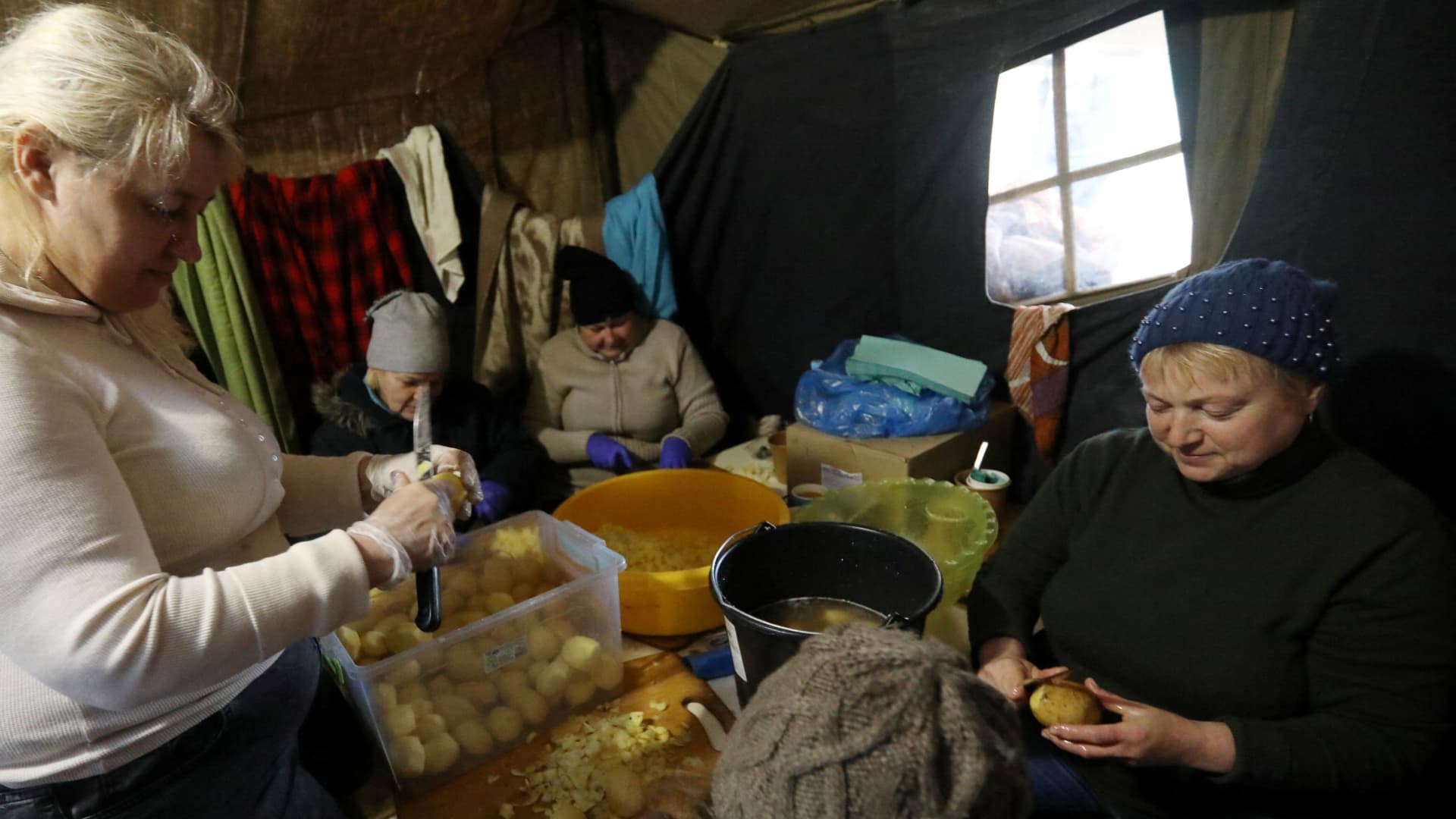 Women prepare food for local residents and members of the Territorial Defence Forces at a field kitchen in Kyiv, Ukraine March 3, 2022.