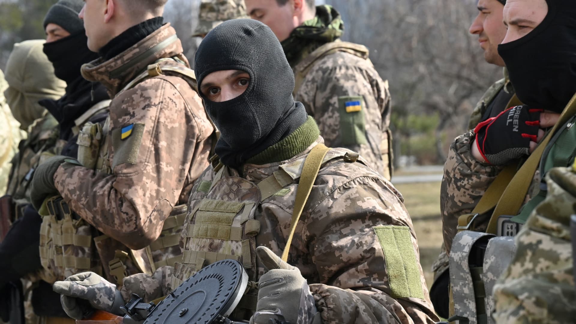 Members of the Ukrainian Territorial Defence Forces examine new armament, including NLAW anti-tank systems and other portable anti-tank grenade launchers, in Kyiv on March 9, 2022, amid the ongoing Russia's invasion of Ukraine.