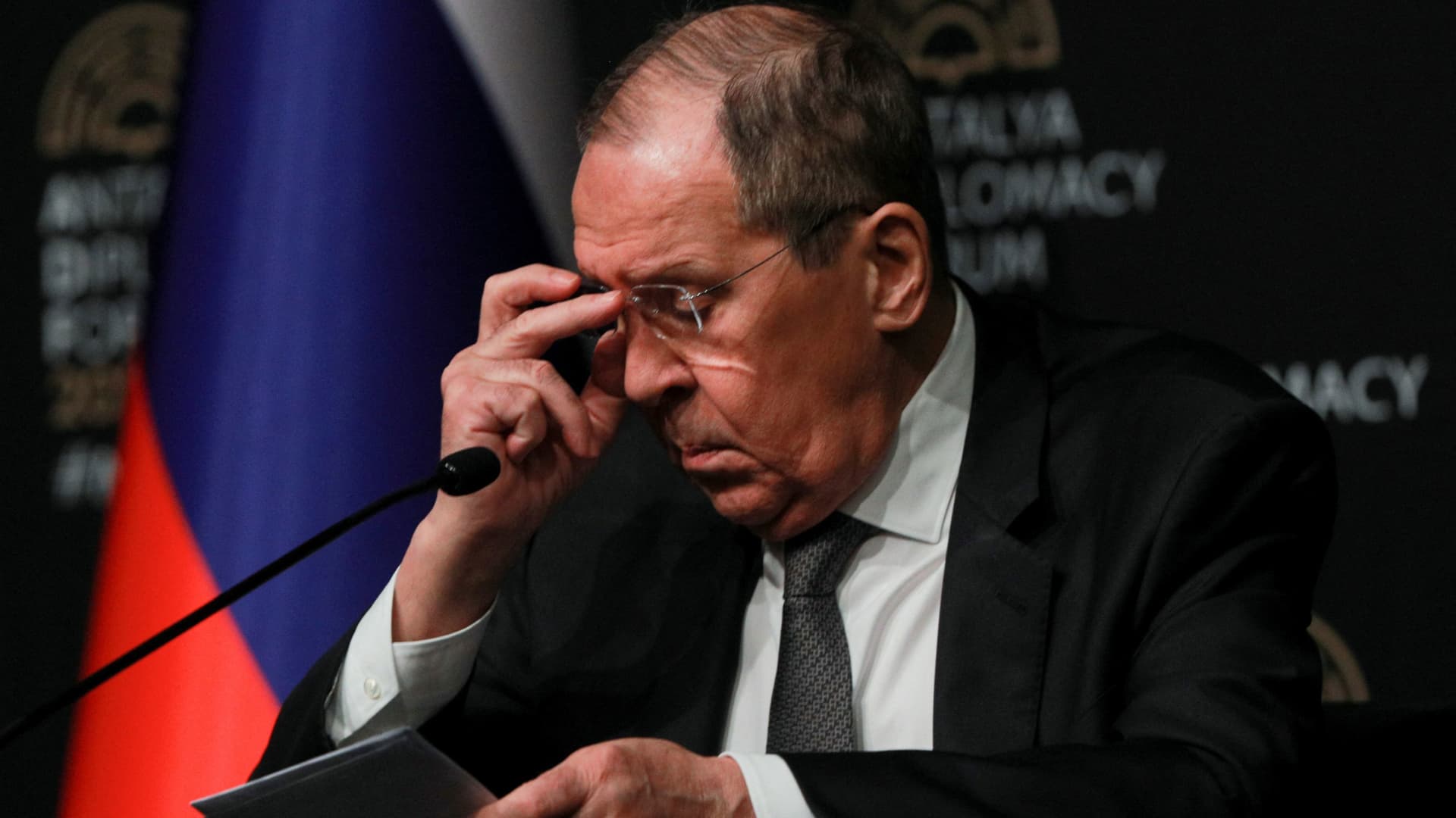 Russian Foreign Minister Sergei Lavrov adjusts his glasses during a news conference after meeting with his counterparts Ukrainian Dmytro Kuleba and Turkish Mevlut Cavusoglu, amid Russia's invasion of Ukraine, in Antalya, Turkey March 10, 2022.