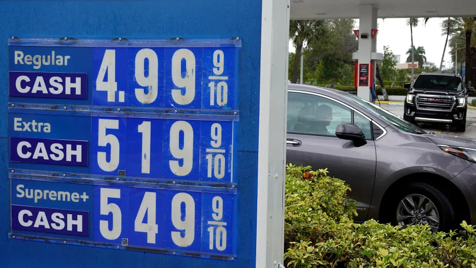 A sign reflects the price per gallon of fuel at a gas station on March 10, 2022 in Miami, Florida.