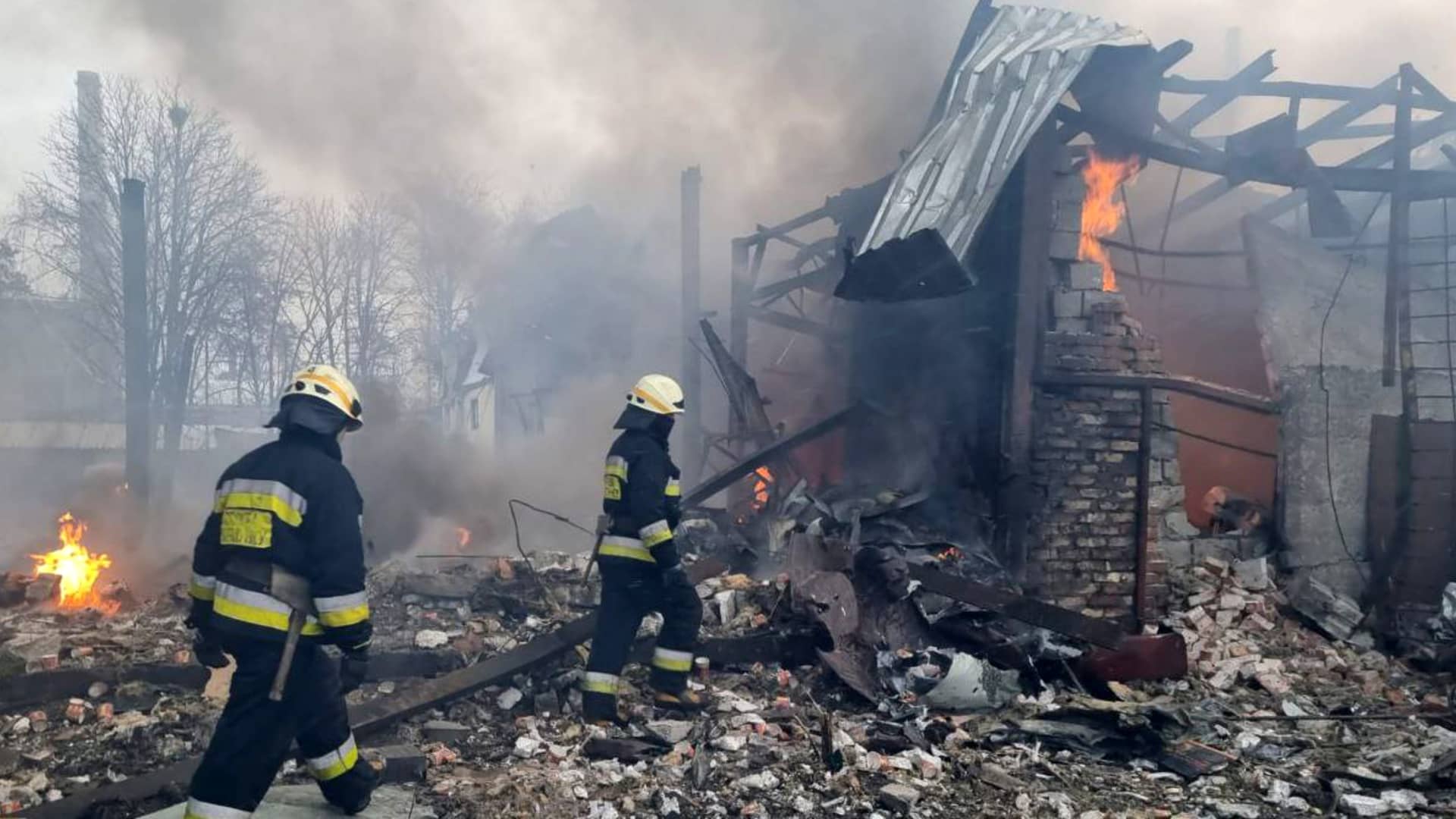 Firefighters are seen at the site after airstrikes hit civil settlements as Russian attacks continue on Ukraine in Dnipro, Ukraine on March 11, 2022.