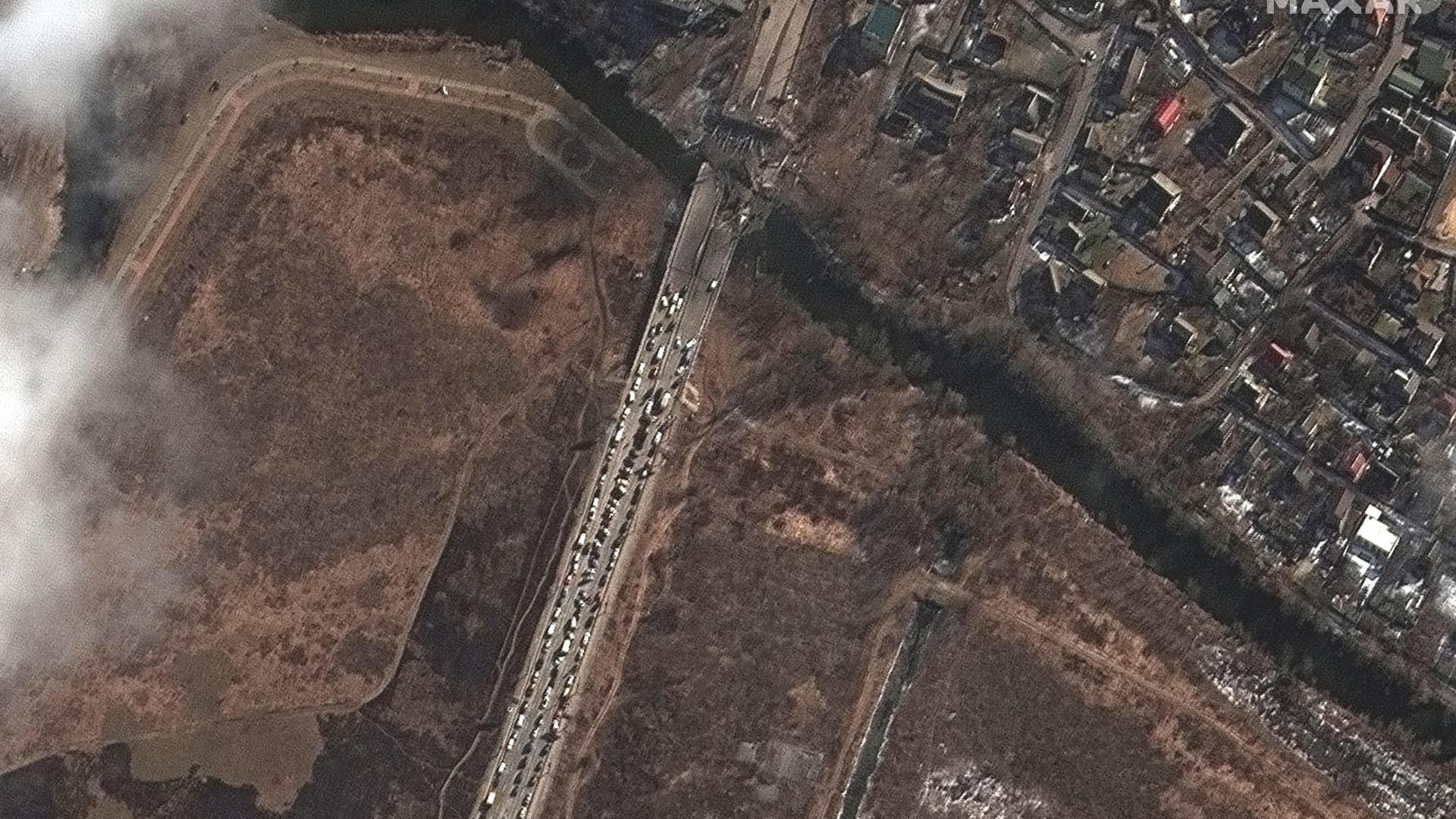 A satellite image shows people and cars waiting by Irpin river bridge, amid Russia's ongoing invasion of Ukraine, in Irpin outside Kyiv, Ukraine, March 10, 2022.
