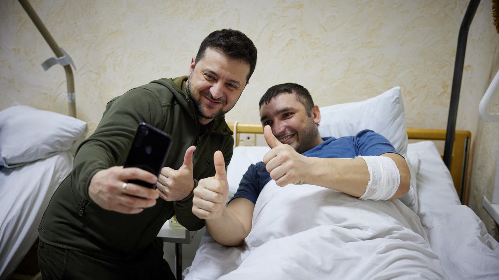 Ukraine?s President Volodymyr Zelenskiy visits an injured Ukrainian serviceman at a military hospital, as Russia's attack on Ukraine continues, in Kyiv, Ukraine March 13, 2022.