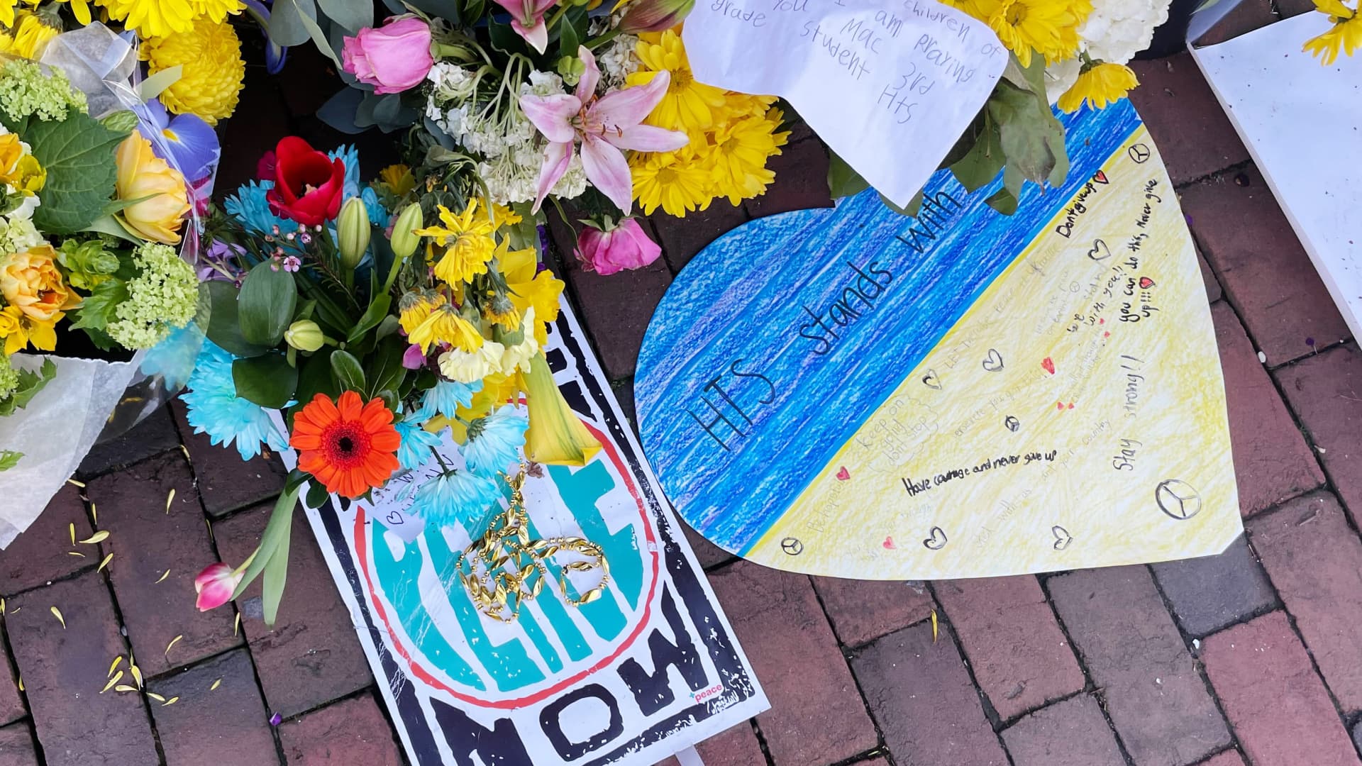 Notes and flowers are left outside the Ukraine Embassy in Washington D.C.