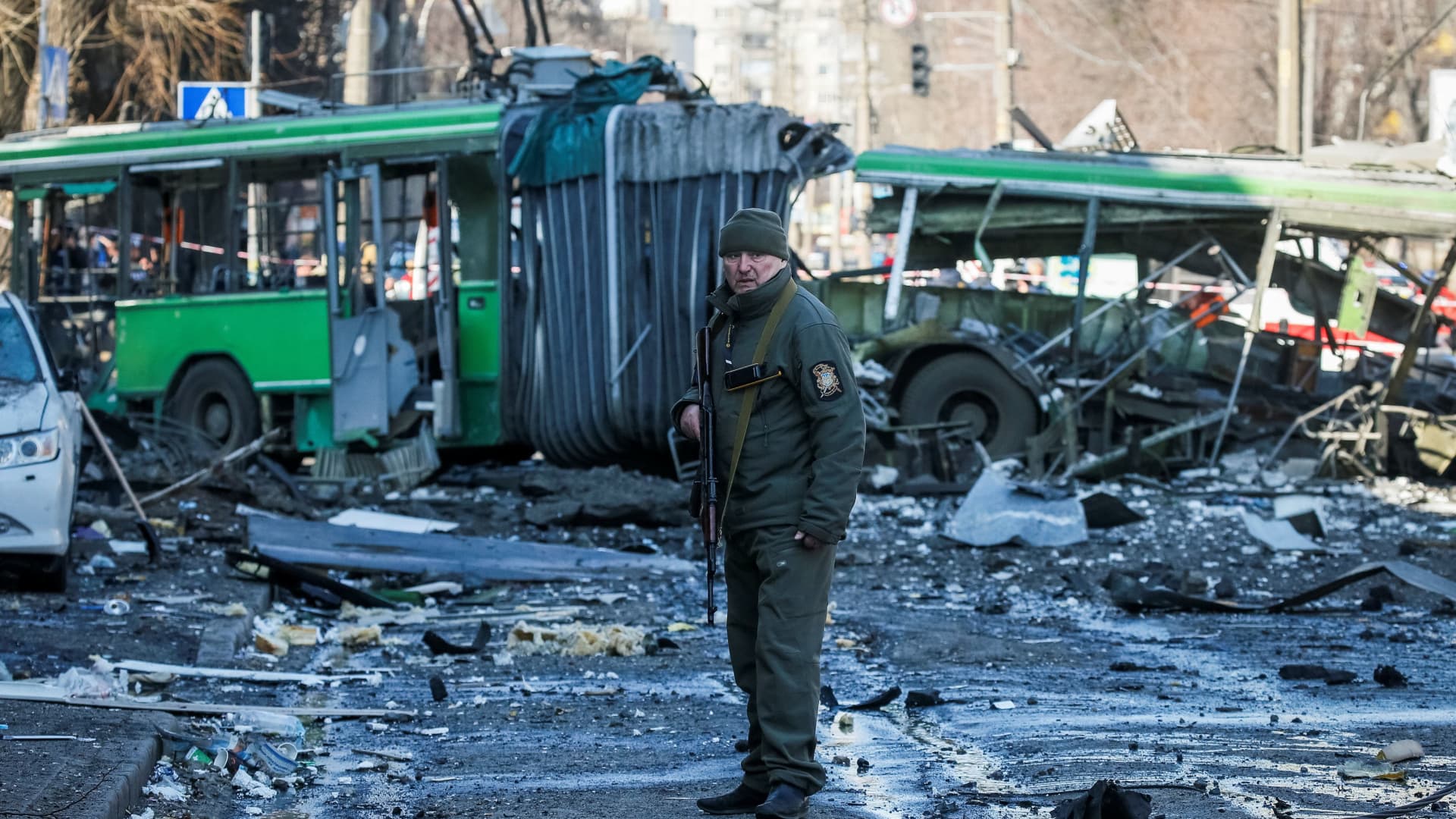 A police officer guards an area around a building destroyed by shelling as Russia's attack on Ukraine continues, in Kyiv, Ukraine March 14, 2022.