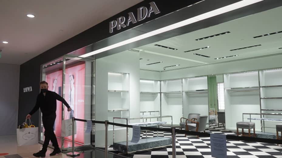 A seller leaves a Prada store, which decided to stop doing business in Russia on March 9, 2022 in Moscow, Russia.
