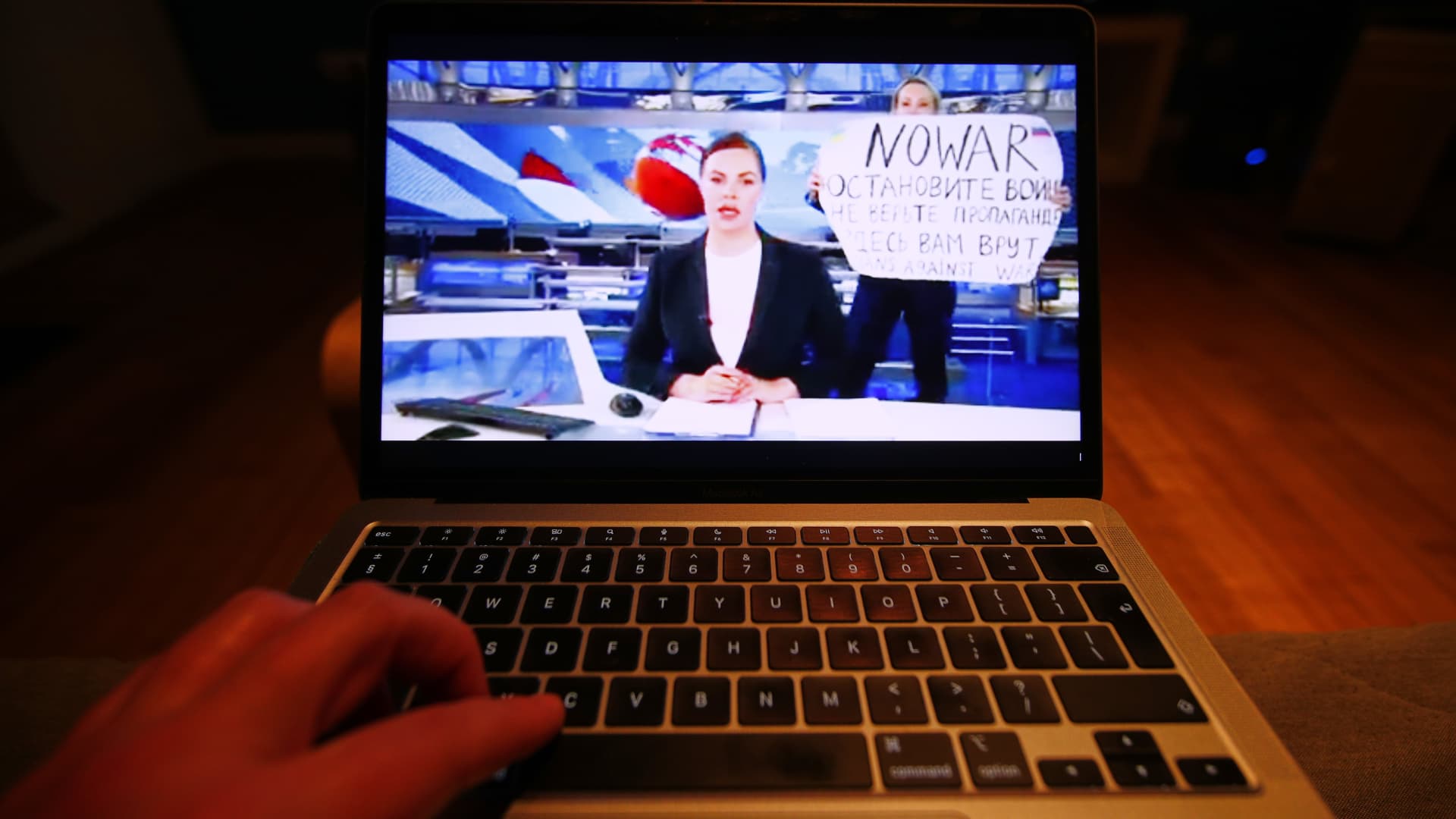 The evening news broadcast on the main Russian news channel, Channel 1 is seen on a laptop as it is interrupted by a woman protesting the war in Ukraine in this illustration photo on 15 March, 2022 in Warsaw, Poland. Marina Ovsyannikova, an employee of the network ran onto the stage with a sign reading 'No War' and 'They're lying to you here'.