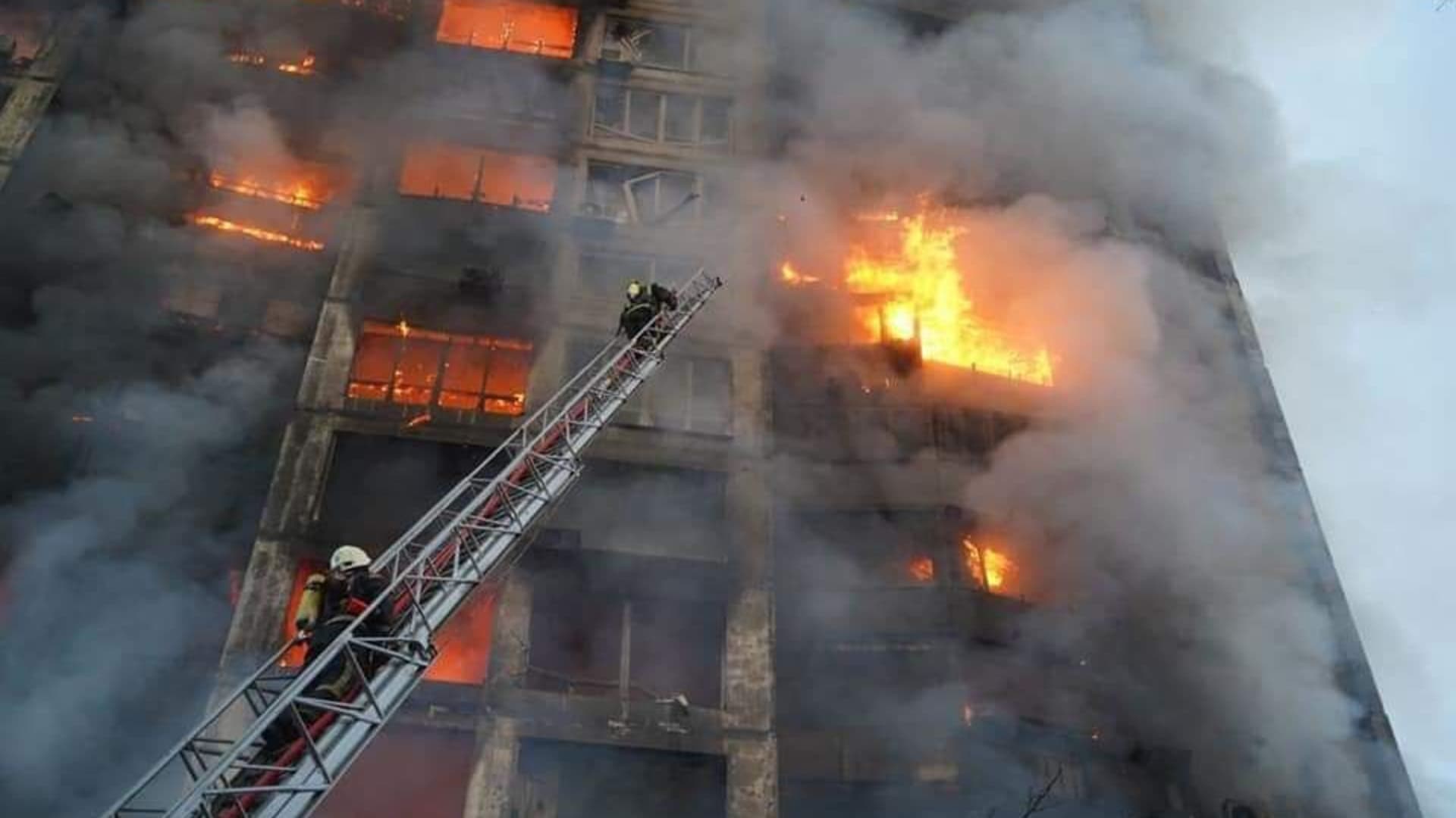 Firefighters try to extinguish a fire after a residential building hit by a Russian attack in Kyiv, Ukraine on March 15, 2022.