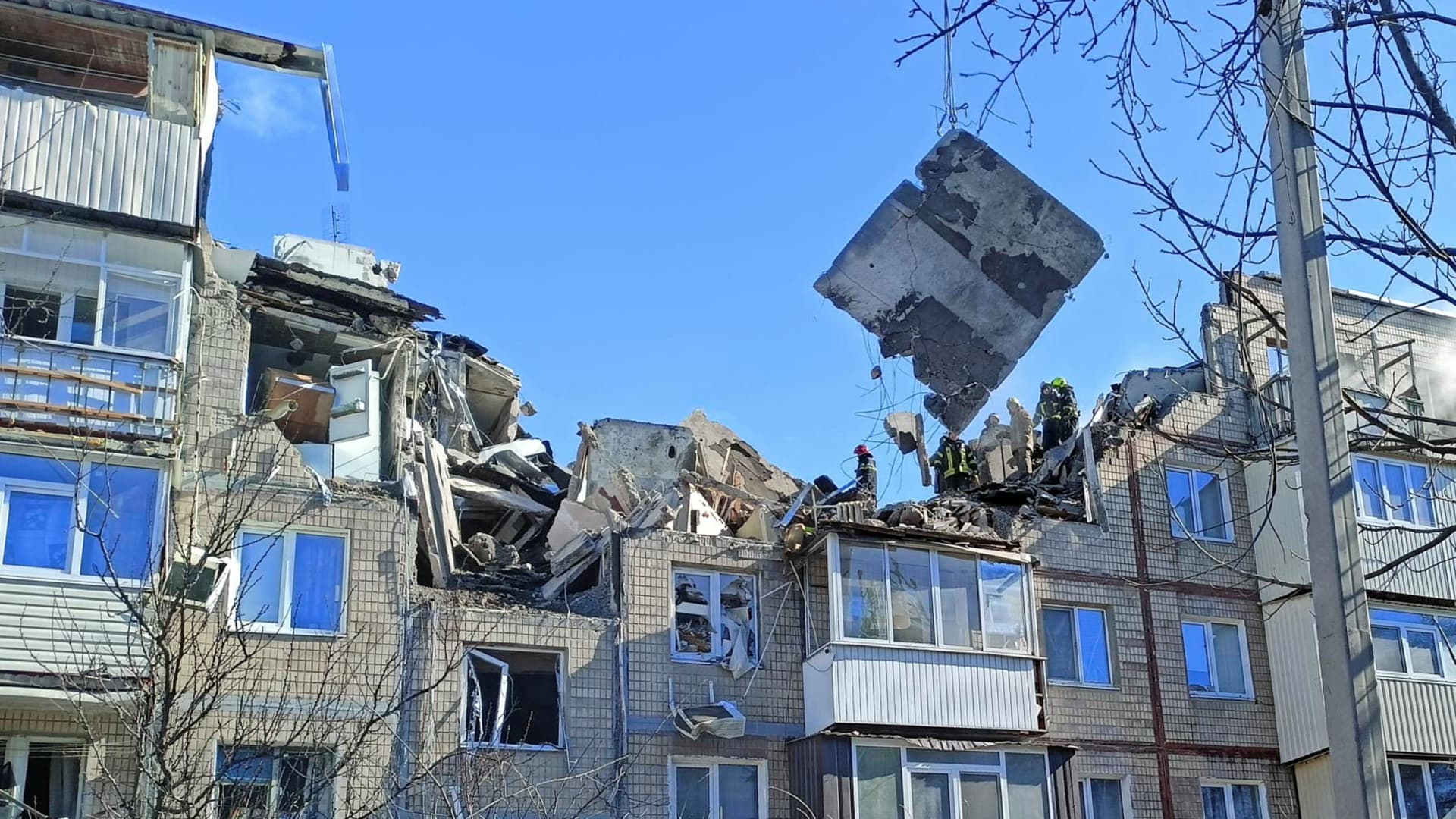 Rescuers remove debris from a residential building damaged by an airstrike, as Russia?s attack on Ukraine continues, in Kharkiv, Ukraine March 15, 2022.