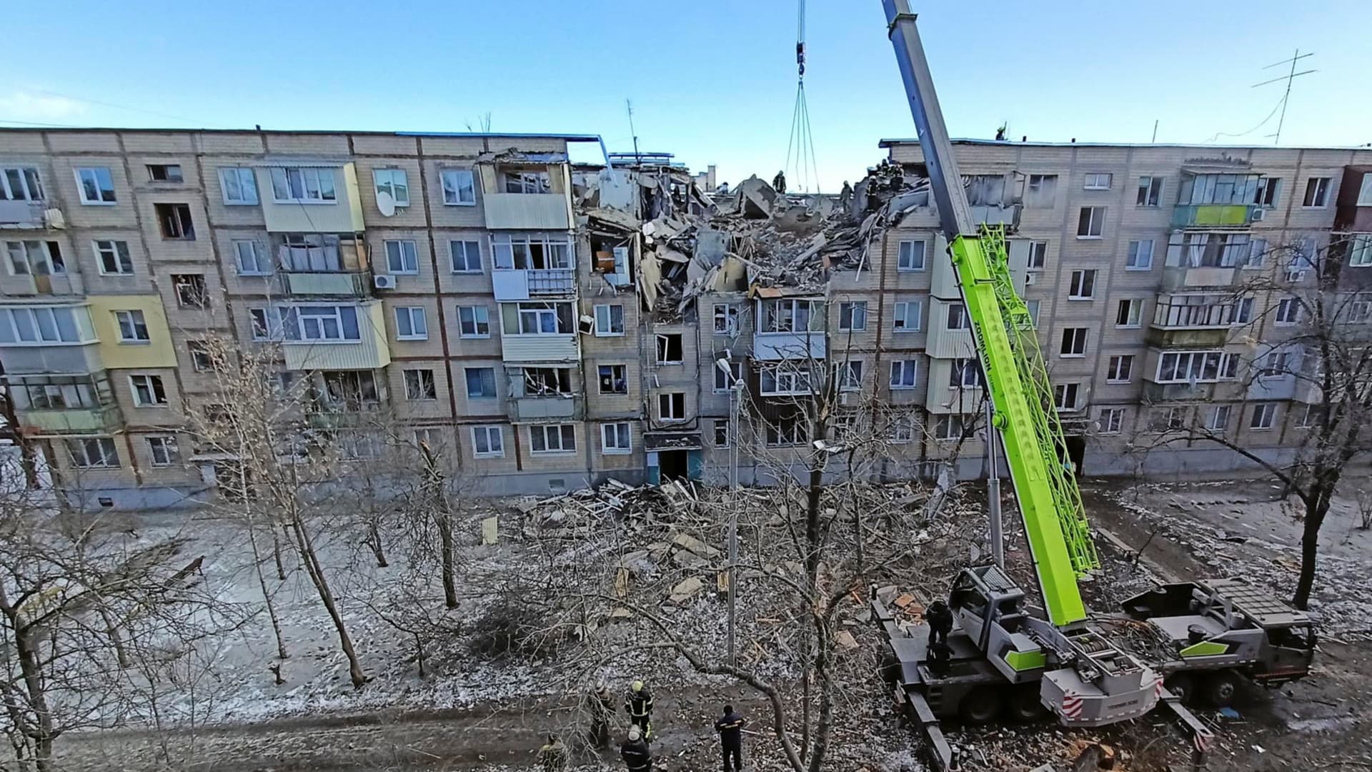 Rescuers remove debris from a residential building damaged by an airstrike, as Russia?s attack on Ukraine continues, in Kharkiv, Ukraine March 15, 2022.
