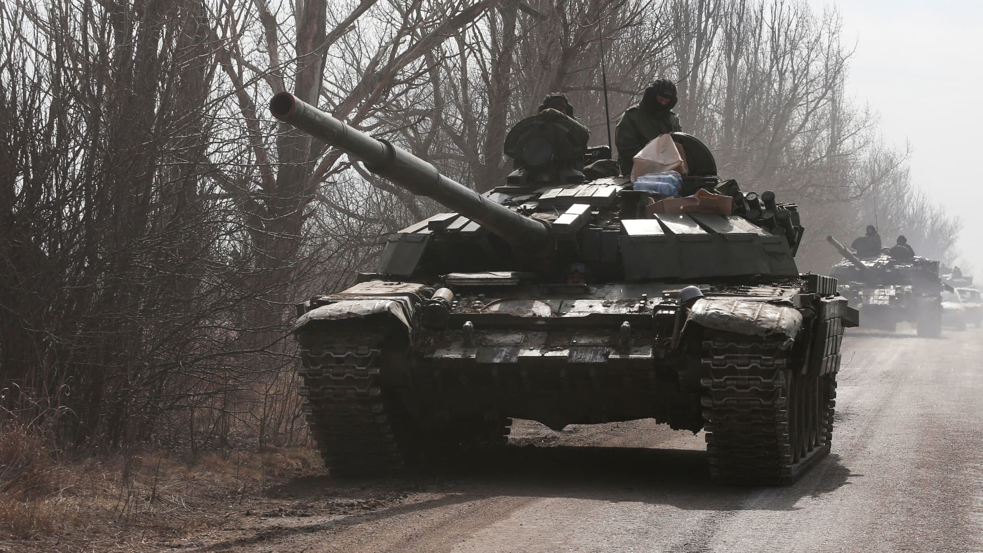 Service members of pro-Russian troops in uniforms without insignia are seen atop of a tank during Ukraine-Russia conflict outside the separatist-controlled town of Volnovakha in the Donetsk region, Ukraine March 15, 2022. 