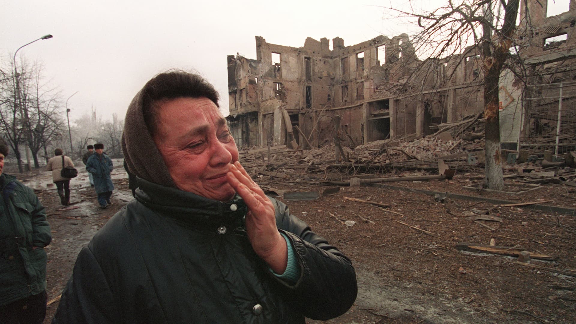 A Chechen woman cries as she walks past one of the main streets in Grozny 28 December 1994, capital of the breakaway southern republic of Chechnya, destroyed by heavy Russian bombings. Russian troops entered Chechnya 11 December 1994 with the stated aim of introducing constitutional rule in the Caucasus republic.