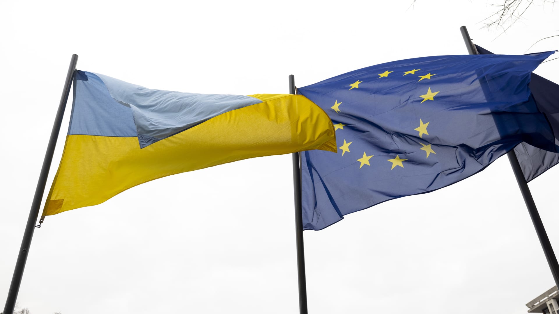 A national flags of Ukraine an EU flags outside the Town Hall in Lille, France, on Wednesday, March 16, 2022.