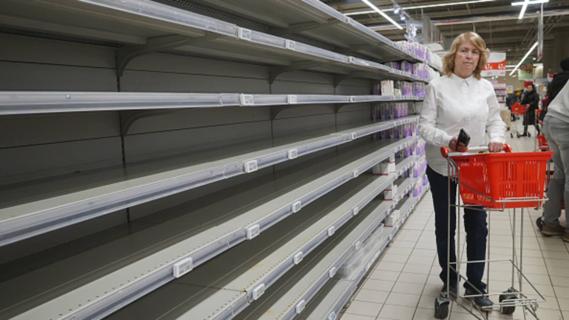 A woman looks at empty shelves in a shopping mall on March 16, 2022, in Moscow, Russia.