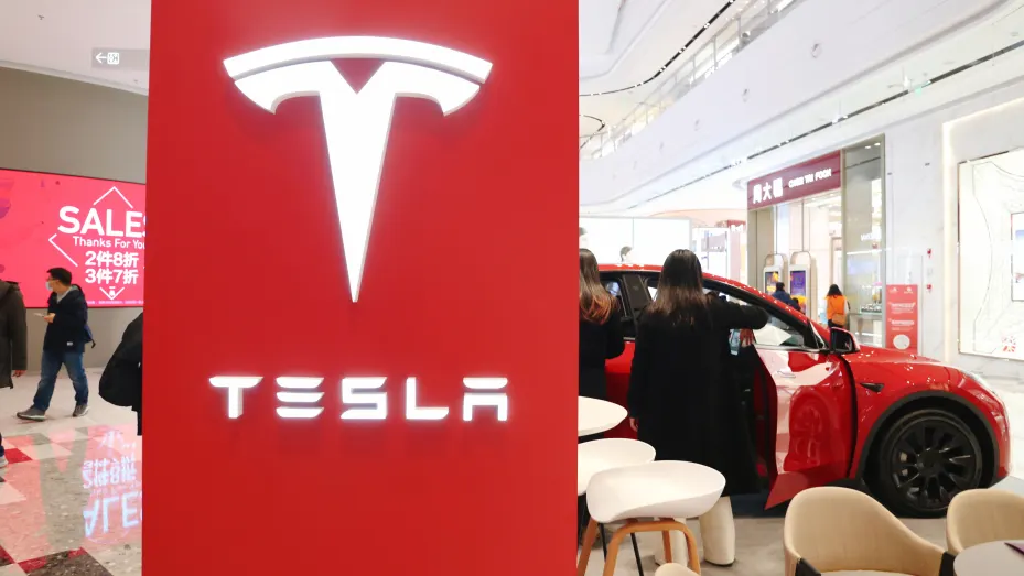 Customers experience new energy electric vehicles at a Tesla store in Shanghai, China, On December 4, 2021.