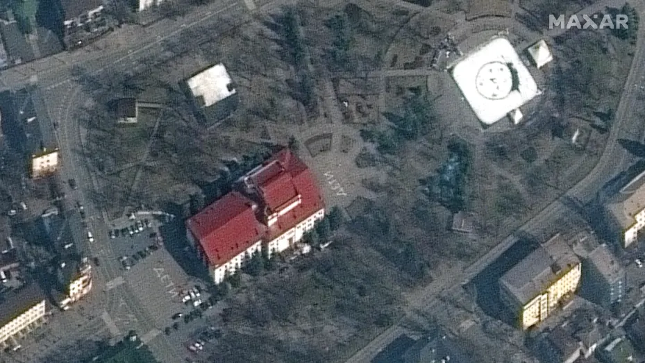 Image appearing to show theater in Mariupol on March 14, prior to its bombing on March 16. The image appears to show the word "children" spelled out in Russian in front of and behind the theater.
