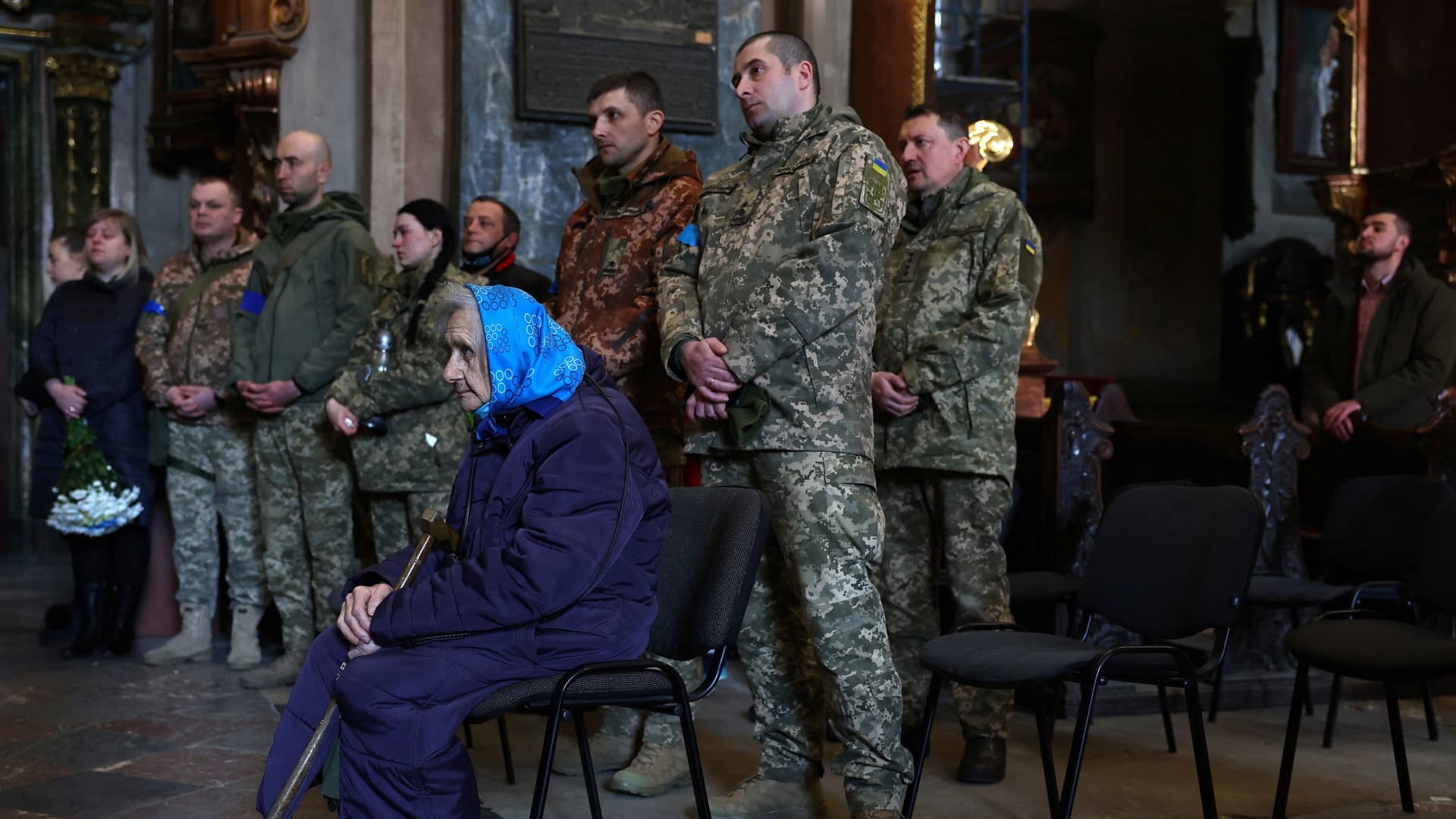 Family members and comrades of Ivan Skrypnyk, who was killed in a rocket attack against a military base in Yavoriv during the ongoing Russian invasion, pays their last respect during his memorial service in Lviv, Ukraine, March 17, 2022.