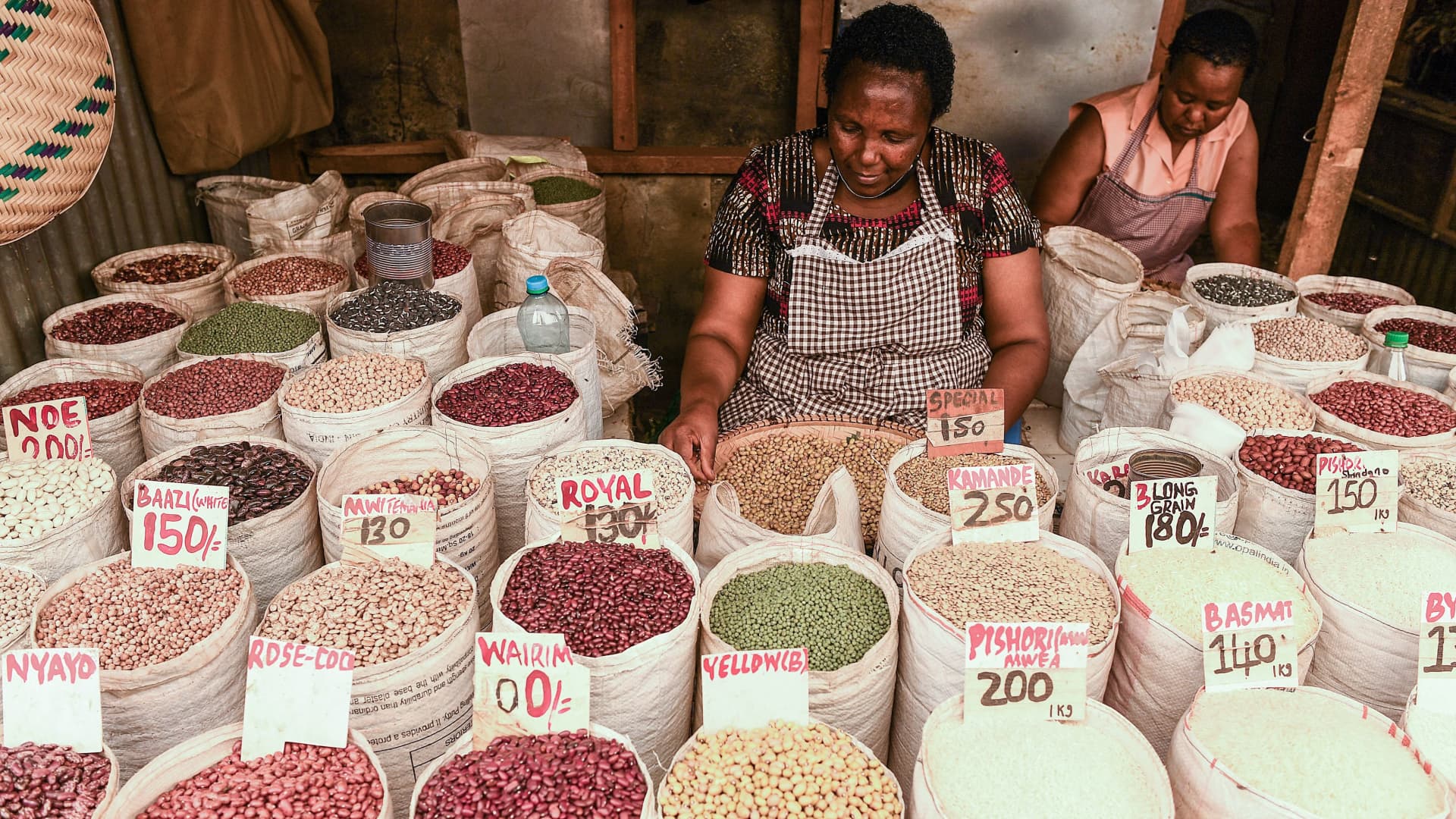 A vendor sells cereals in Nairobi on March 16, 2022. African countries are feeling the pain of Ukraine's crisis as supply disruptions hike inflation and oil prices push up fuel costs.