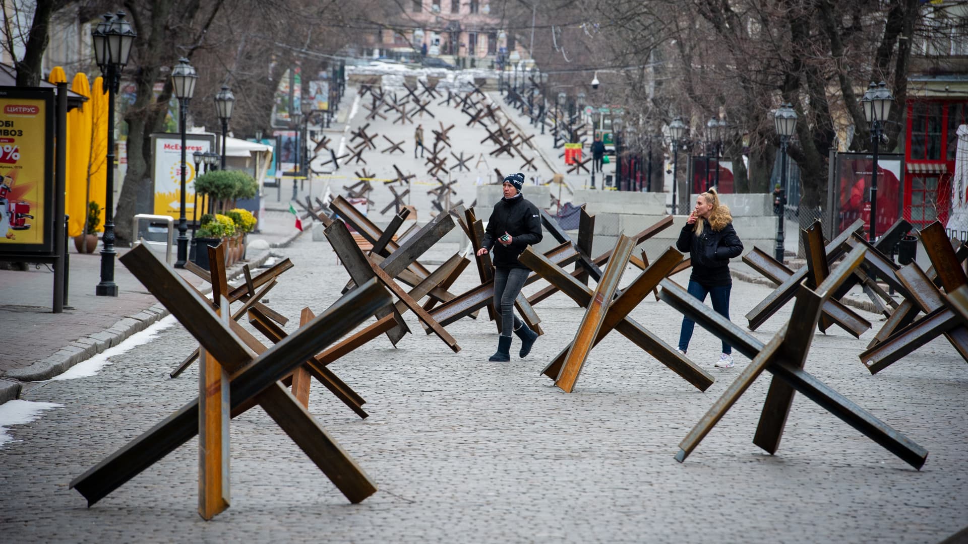 People walk among anti-tank barriers placed to protect historic landmarks in expectation of a Russian assault on the strategic Black Sea port city on March 14, 2022 of Odessa, Ukraine. 
