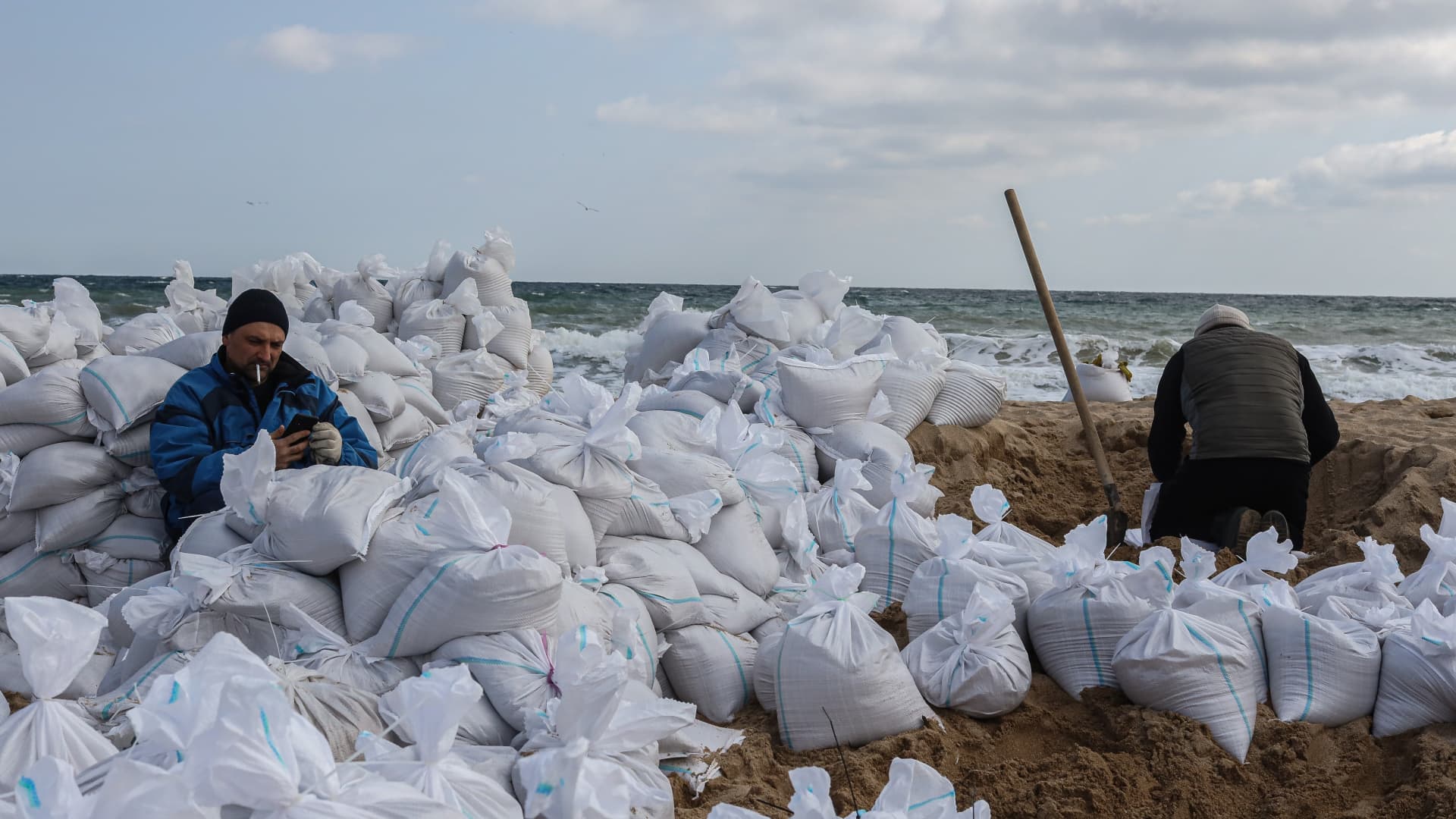 Volunteers fill sand bags at a beach in Odesa, Ukraine, on Wednesday, March 16, 2022.