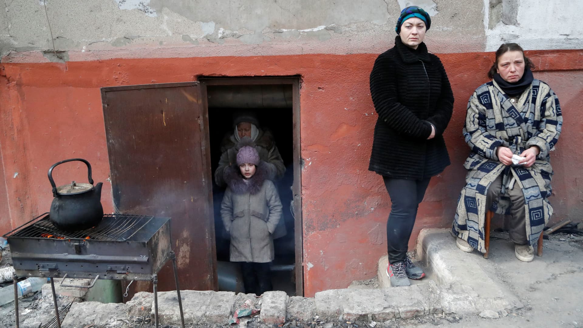Local residents, who seek refuge in the basement of a building during Ukraine-Russia conflict, are seen in the besieged southern port city of Mariupol, Ukraine March 17, 2022.