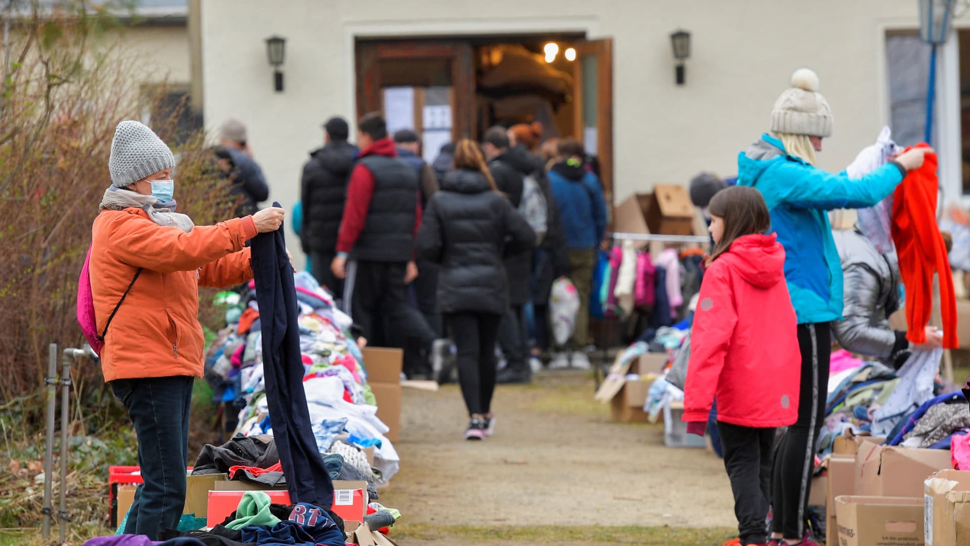Refugees from Ukraine look for textiles in a donation collection point organised by Dresden's Ukraine Catholic parish, amid Russia's invasion of Ukraine, in Dresden, Germany, March 17, 2022.