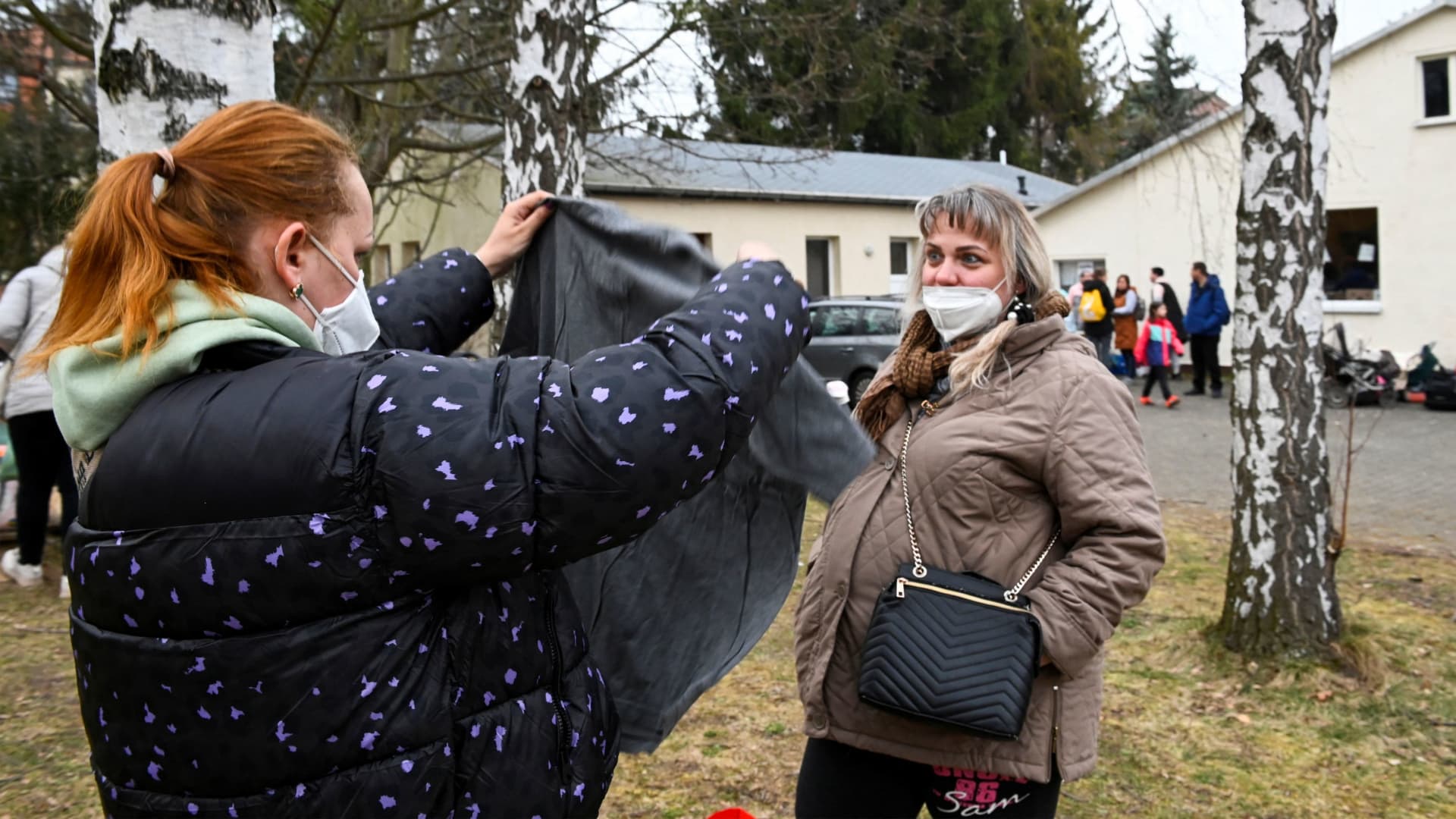 Refugees from Ukraine look for clothing in a donation collection point organised by Dresden's Ukraine Catholic parish, amid Russia's invasion of Ukraine, in Dresden, Germany, March 17, 2022.