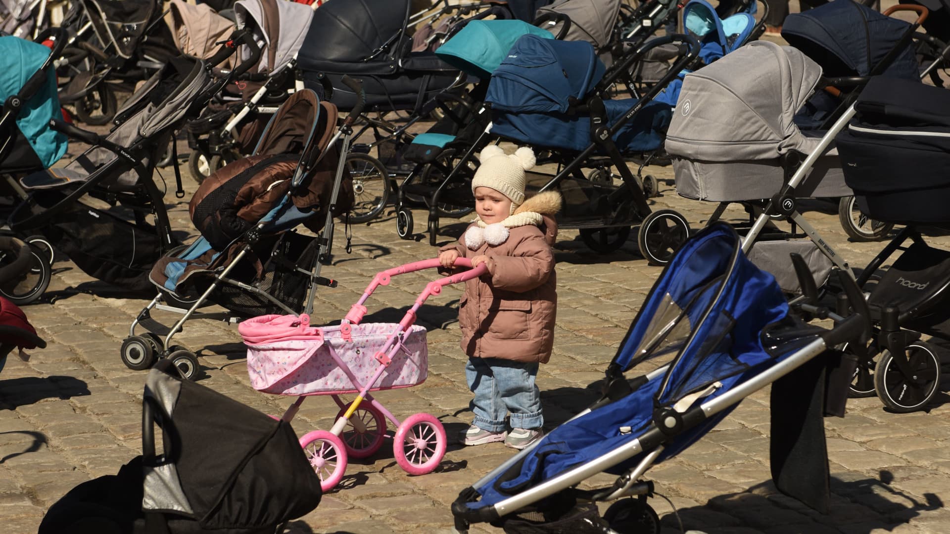 In this picture taken on March 18, 2022, empty strollers are seen placed outside the Lviv city council during an action to highlight the number of children killed in the ongoing Russia's invasion of Ukraine.