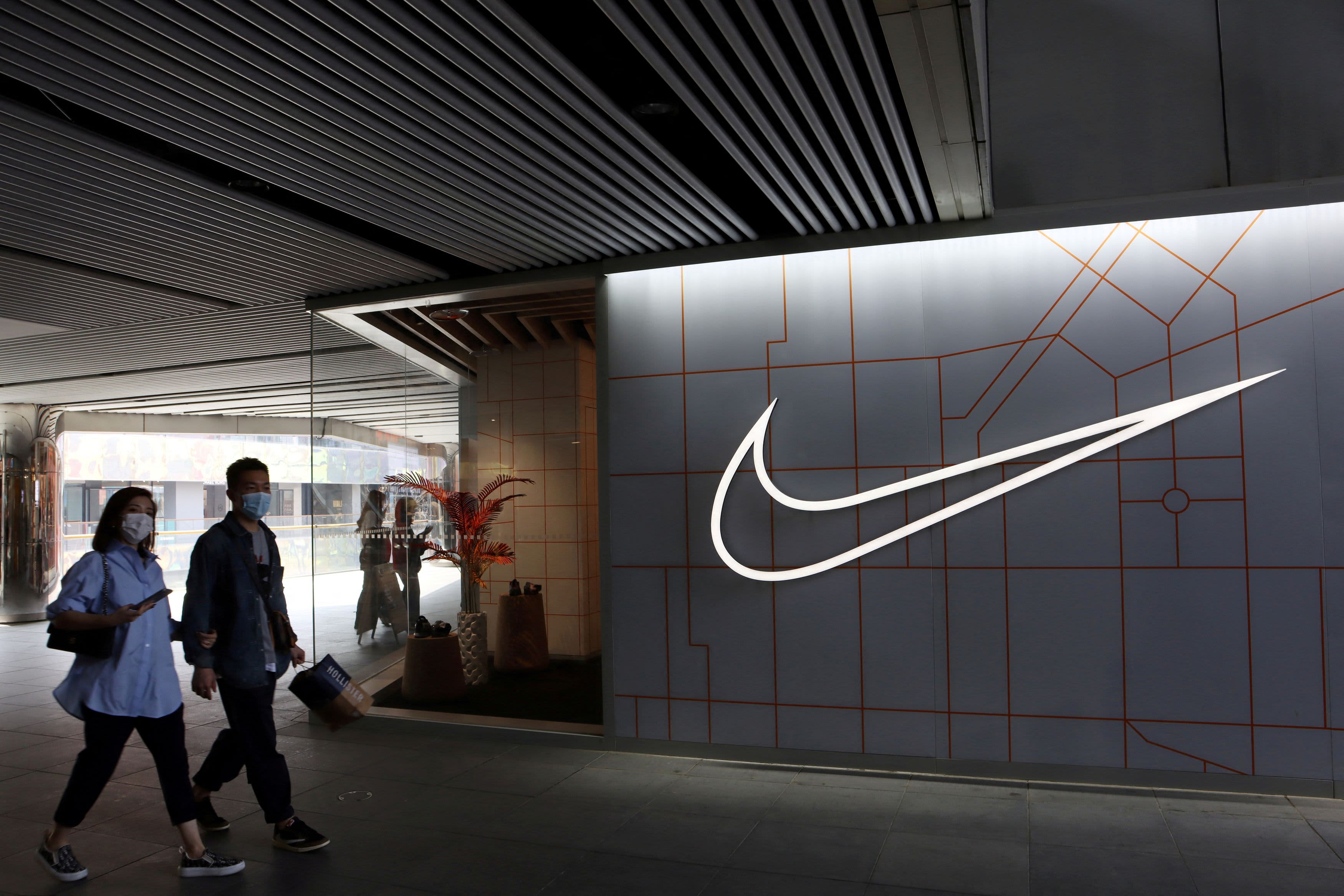 Stocks making the biggest moves midday: Nike, La-Z-Boy, Altria Group,  Coinbase, Dow & more