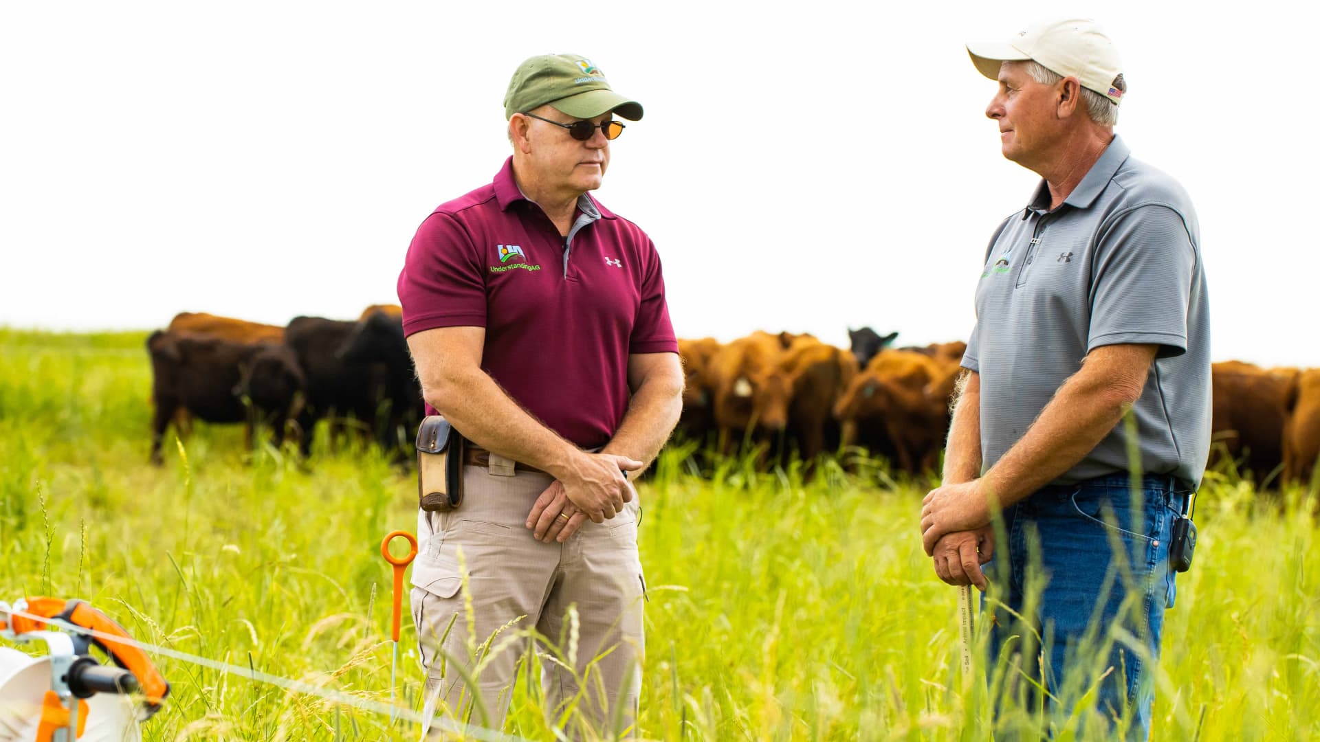 Allen Williams (left), a sixth generation family farmer and founding partner of Understanding Ag, teaching another farmer about regenerative grazing.