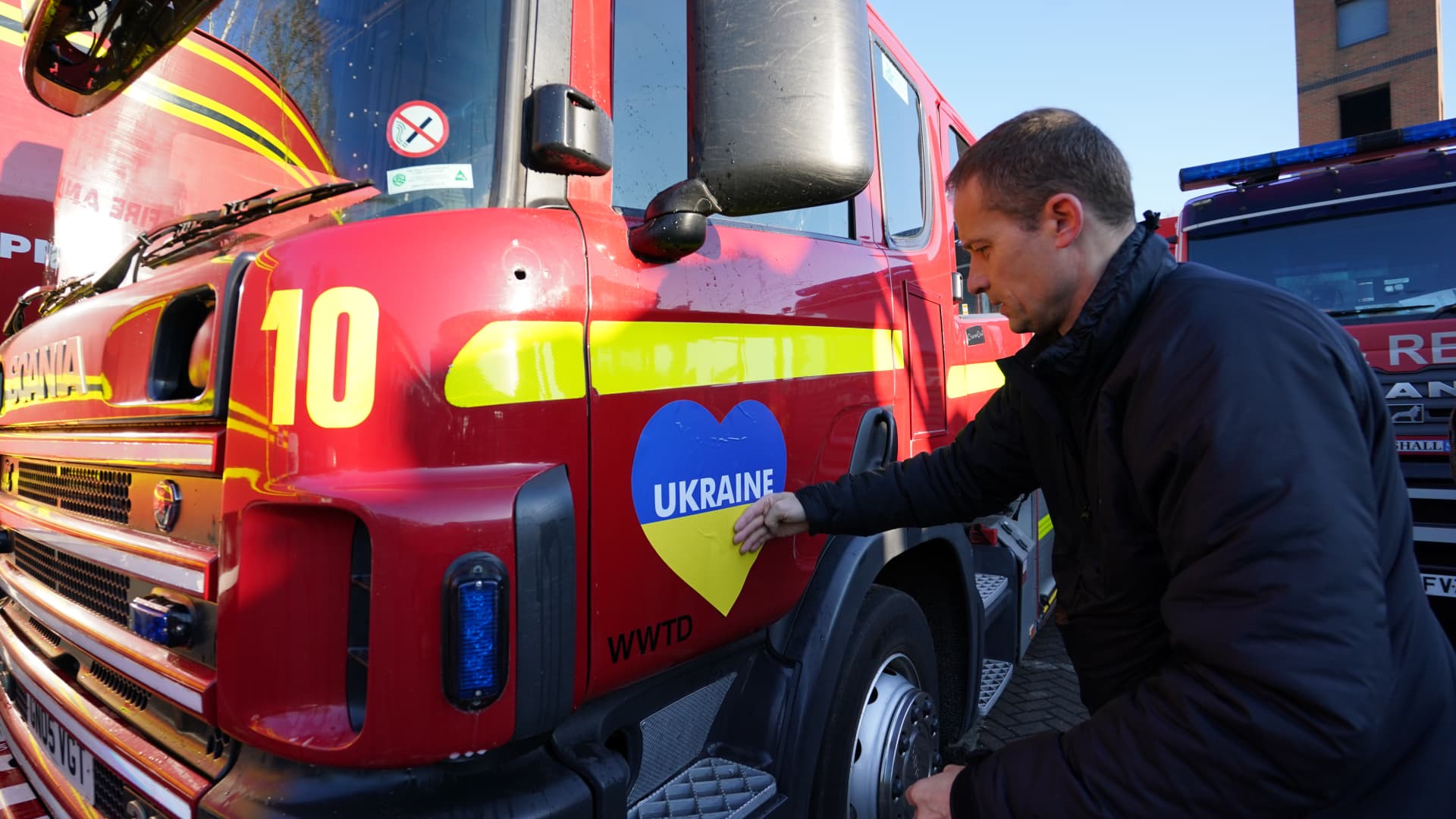 Fire officers at Ashford fire station prepare vehicles and donated emergency service equipment, organised by Fire AID and the National Fire Chiefs Council, prior to a convoy of vehicles setting off from Ashford, Kent, for the Polish border of Ukraine. Picture date: Saturday March 19, 2022.