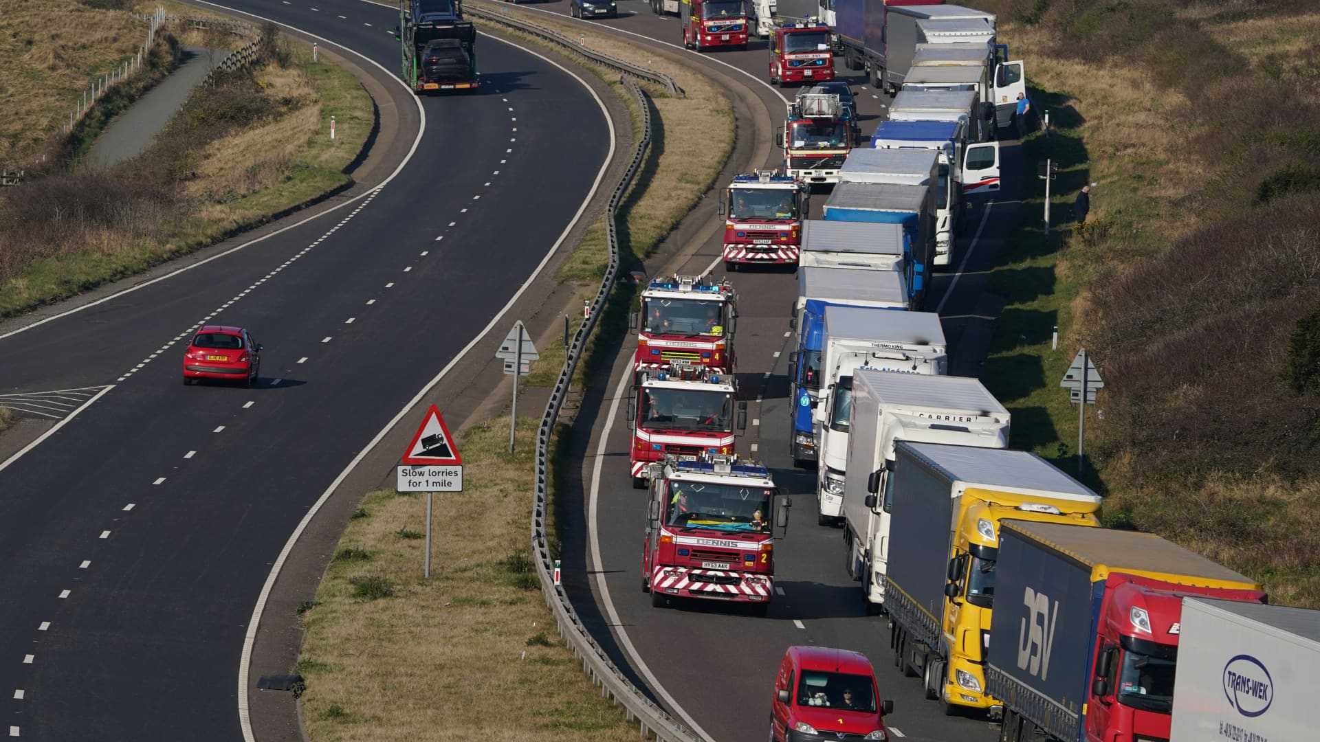 A convoy of donated emergency service equipment, organised by Fire AID and the National Fire Chiefs Council, travels towards Dover on the A20 in Kent, heading for the Polish border with Ukraine. Picture date: Saturday March 19, 2022.