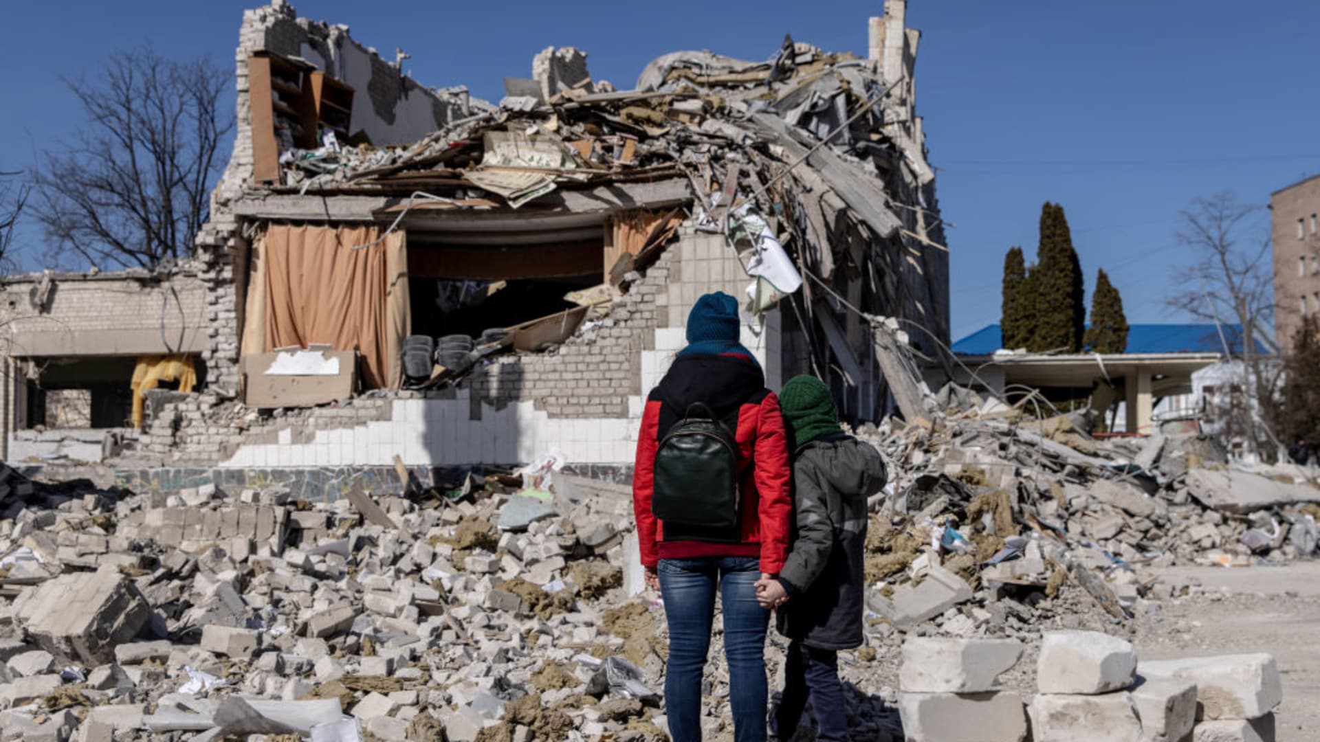 People look at damage at a school that was hit by a Russian attack ten days ago on March 20, 2022 in Zhytomyr, Ukraine.
