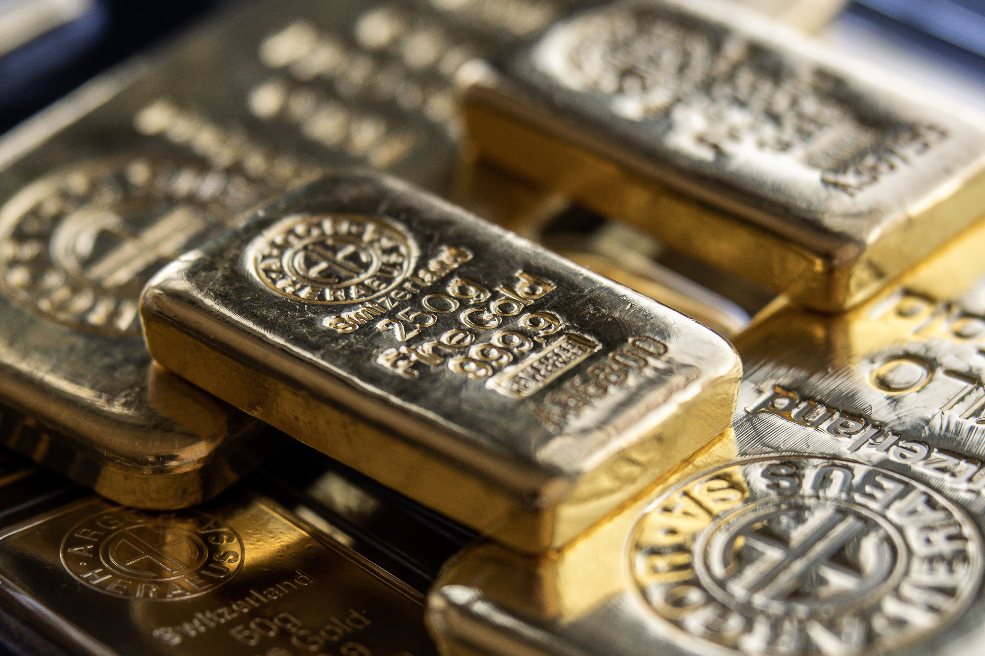 Gold rebounds from 1-month lows as dollar cools