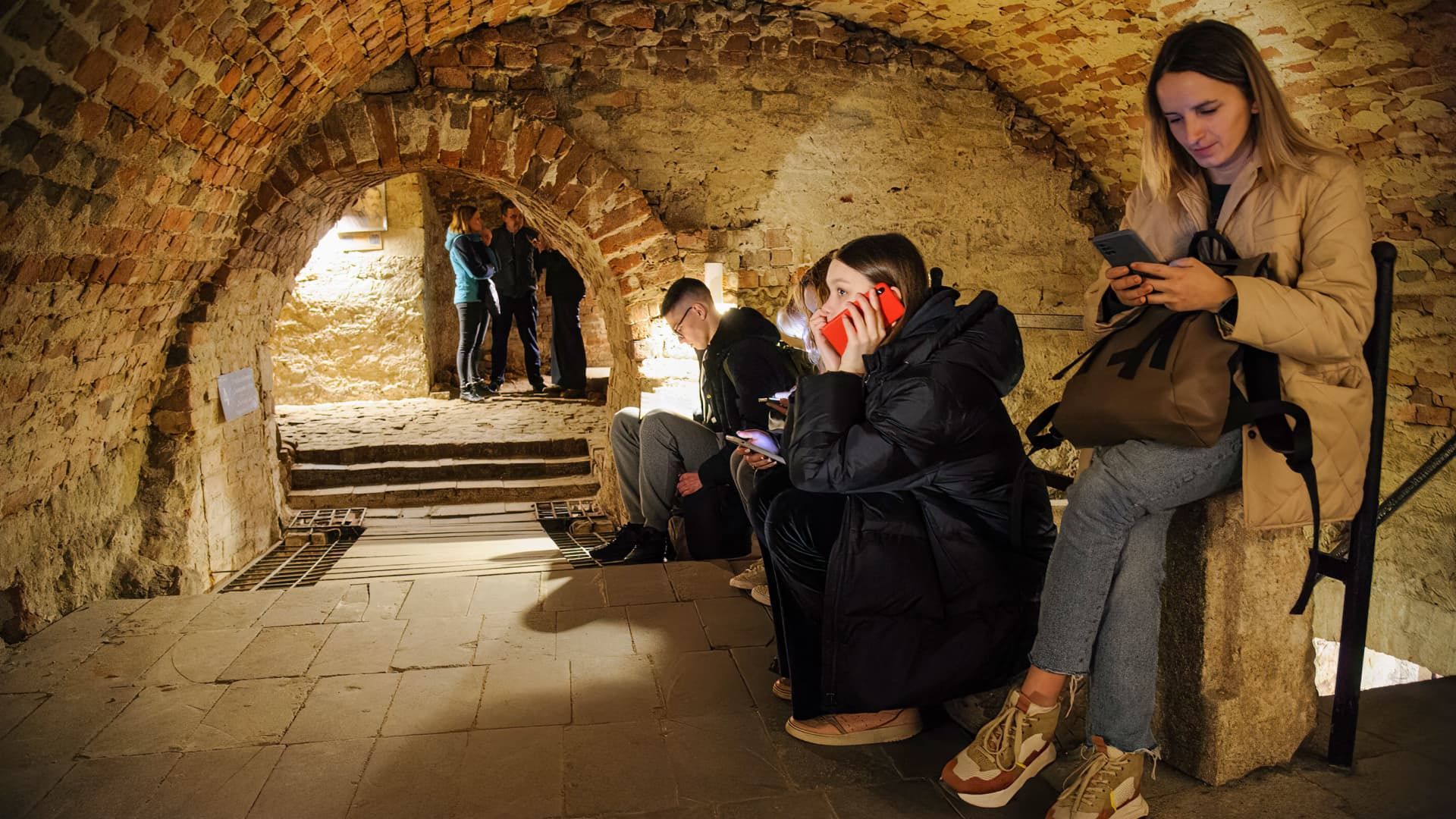People hide in one of the official underground shelters during an air alarm. 