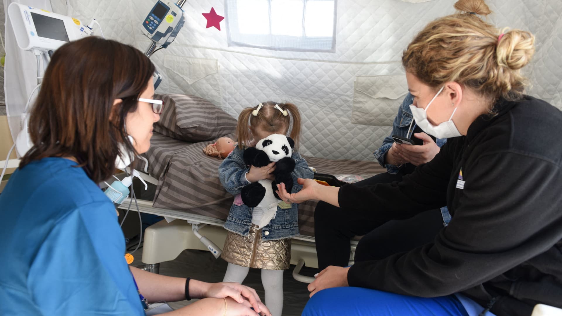 Medical workers tend to a children at Israeli field hospital, in Mostyska near the Polish border, in Lviv, western Ukraine, on March 23, 2022.ISRAEL - Israeli field hospital provide assistance to migrants and residents of Lviv.