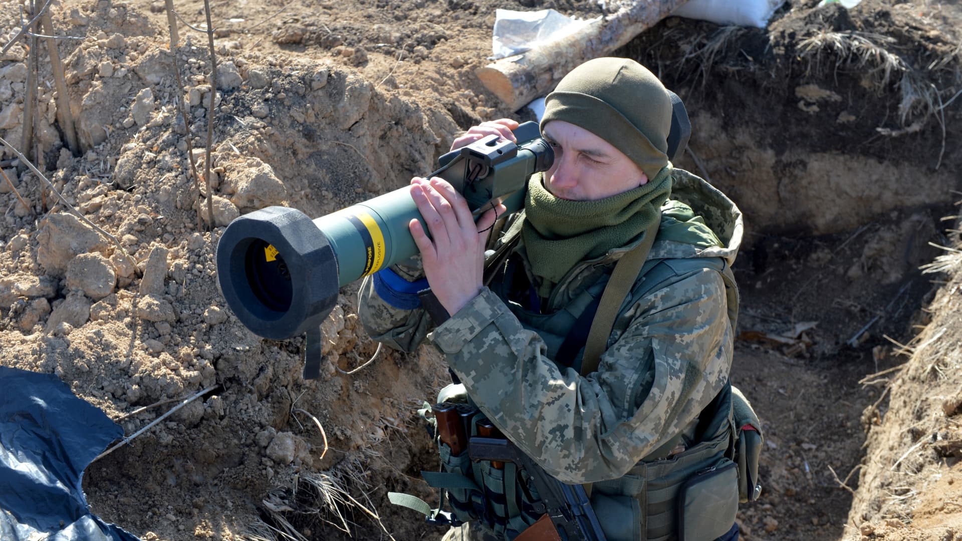 A serviceman of Ukrainian military forces holds a FGM-148 Javelin, an American-made portable anti-tank missile, at a checkpoint, where they hold a position near Kharkiv on March 23, 2022.