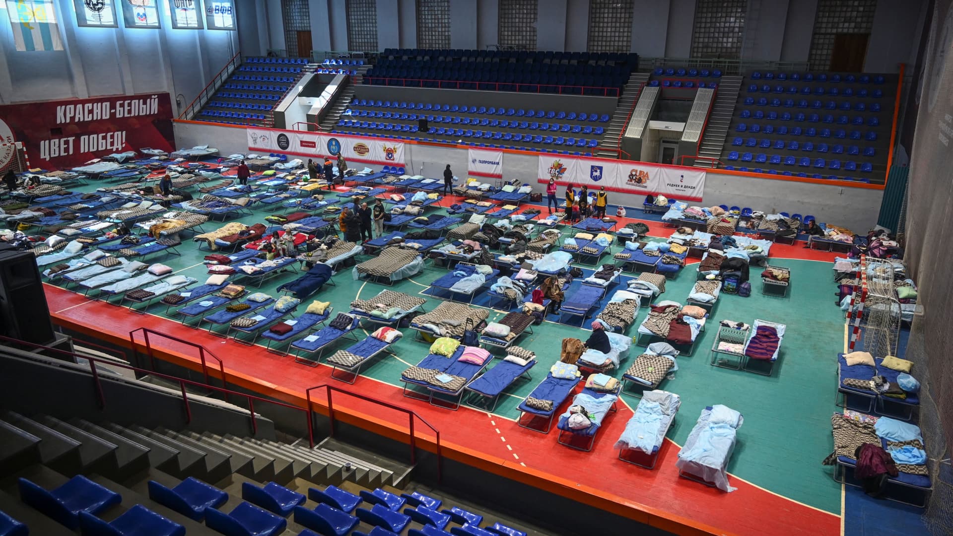 Residents of the Ukrainian city of Mariupol stay at a temporary accommodation centre for evacuees located in the building of a local sports school in Taganrog in the Rostov region, Russia March 23, 2022.