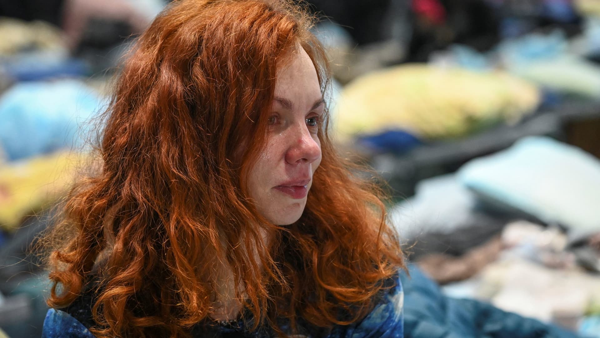 Elena Novosela, a resident of the Ukrainian city of Mariupol, reacts as she stays at a temporary accommodation centre for evacuees located in the building of a local sports school in Taganrog in the Rostov region, Russia March 23, 2022.