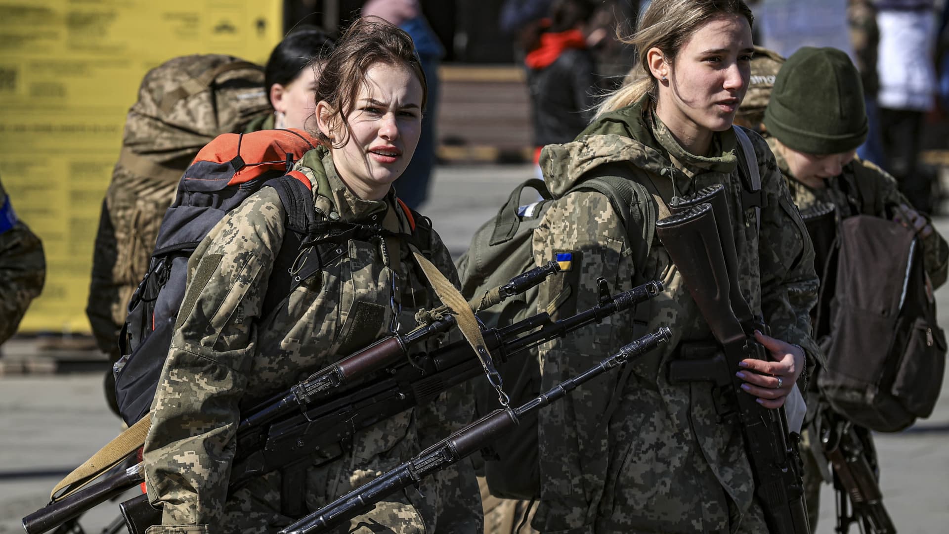 Ukrainian female soldiers are seen before heading to the frontline as Ukrainian displaced civilians continue to swarm around the train station to flee due to ongoing Russian attacks, in Lviv, Ukraine on March 24, 2022.