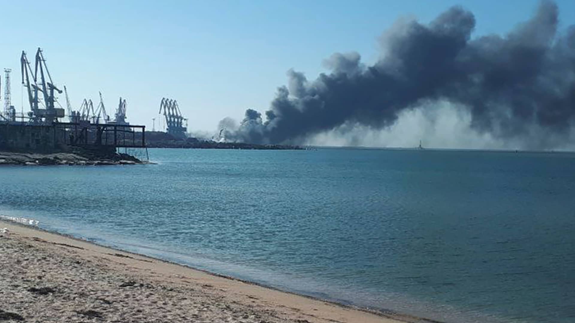 Smoke rises after shelling near a seaport in Berdyansk, Ukraine, Thursday, March 24, 2022. Ukraine's navy reported Thursday that it had sunk the Russian ship Orsk in the Sea of Asov near the port city of Berdyansk.