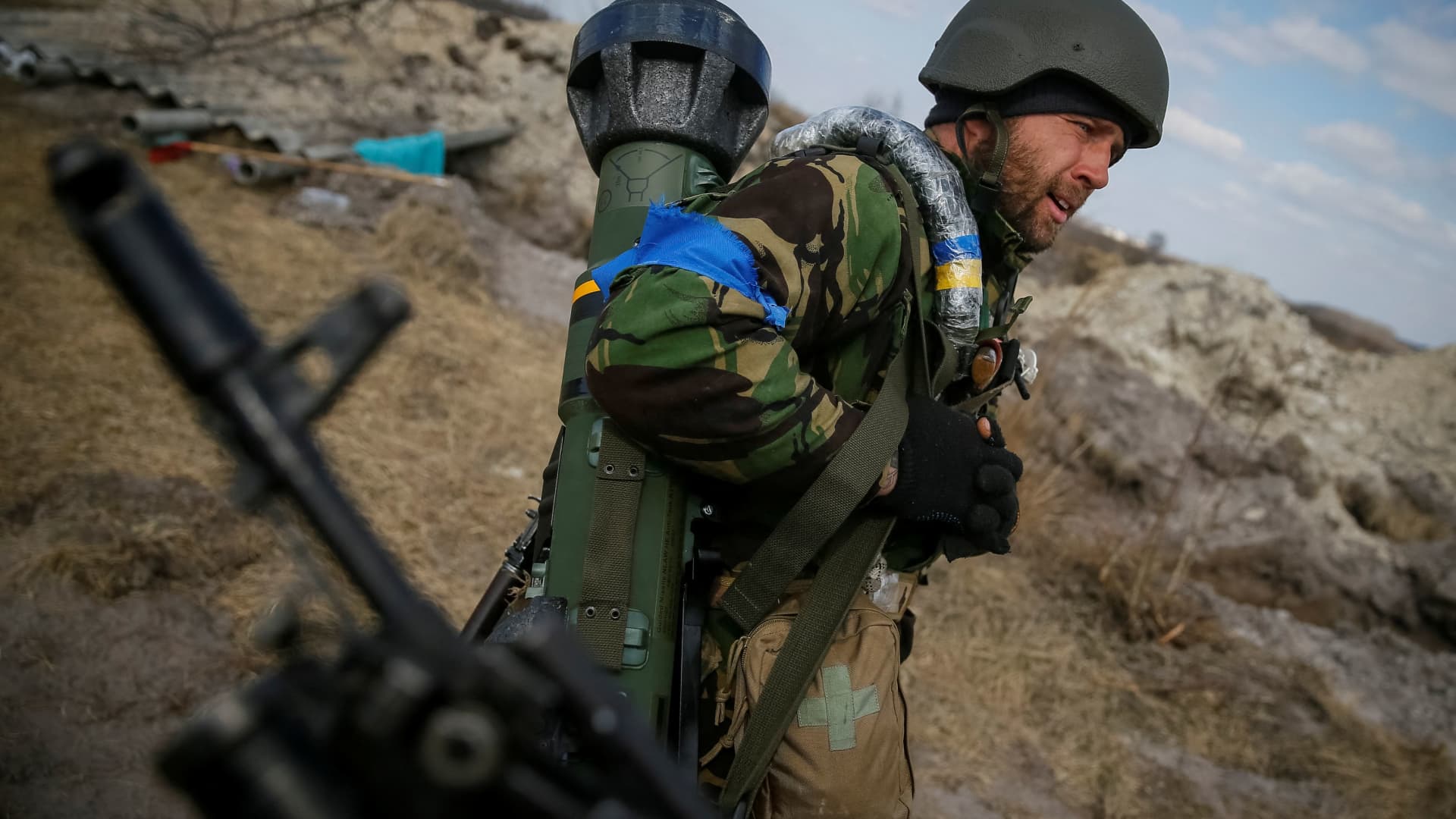 A Ukrainian service member holds a next generation light anti-tank weapon (NLAW) at a position on the front line in the north Kyiv region, Ukraine March 24, 2022.