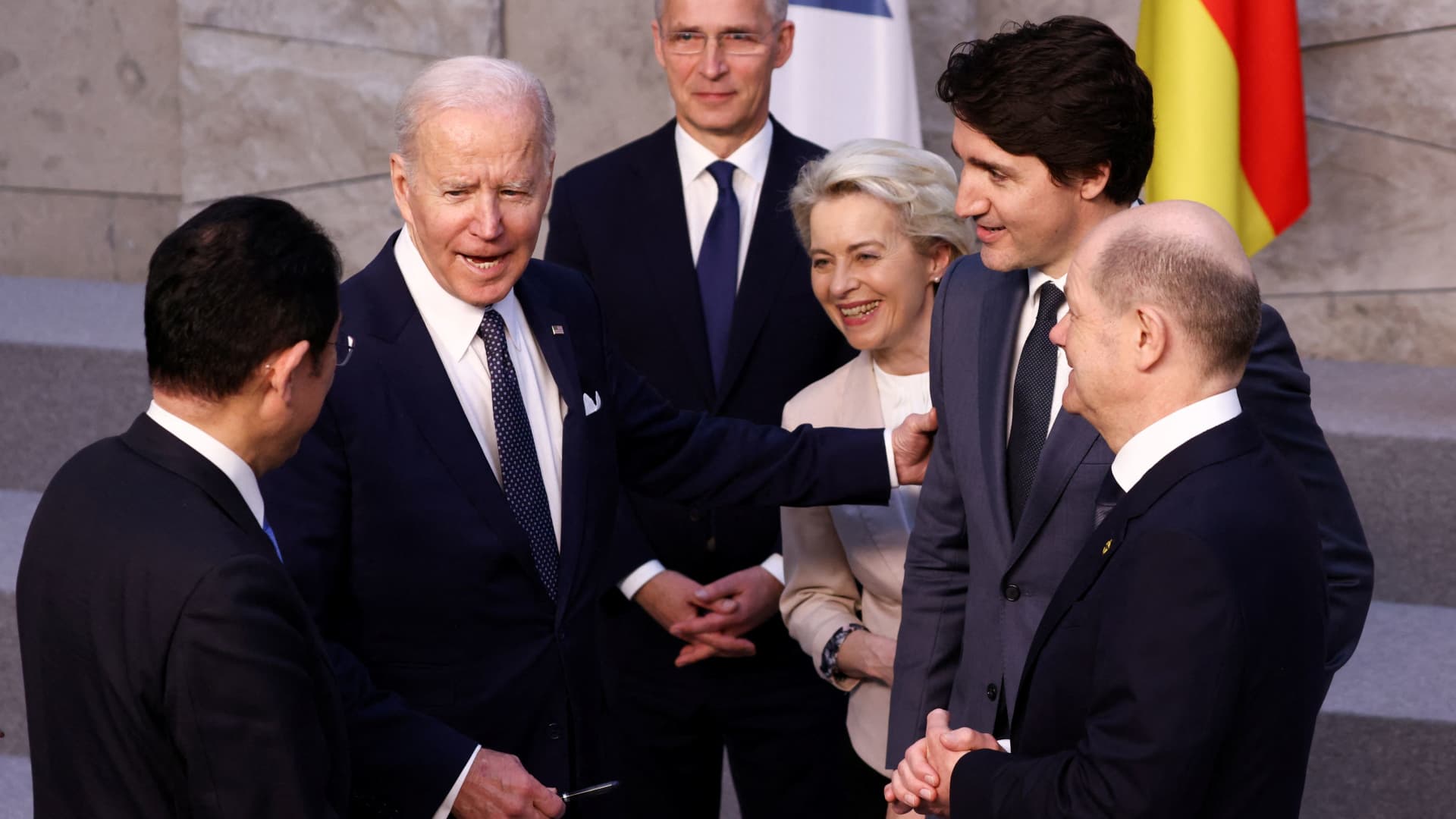 U.S. President Joe Biden speaks with Japan's Prime Minister Fumio Kishida, Germany's Chancellor Olaf Scholz, Canada's Prime Minister Justin Trudeau, European Commission President Ursula von der Leyen and NATO Secretary General Jens Stoltenberg before a G7 leaders' family photo during a NATO summit on Russia's invasion of Ukraine, at the alliance's headquarters in Brussels, Belgium March 24, 2022.