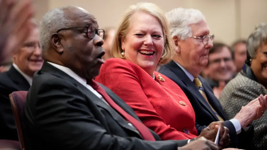 Associate Supreme Court Justice Clarence Thomas sits with his wife and conservative activist Virginia Thomas while he waits to speak at the Heritage Foundation on October 21, 2021 in Washington, DC.