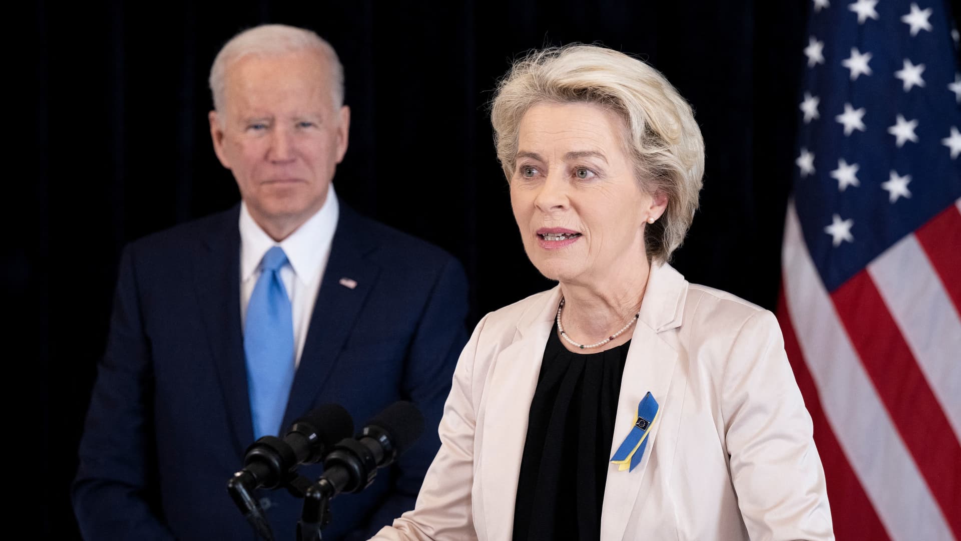 US President Joe Biden listens while European Commission President Ursula von der Leyen makes a statement about Russia at the US Chief of Mission residence in Brussels, on March 25, 2022.
